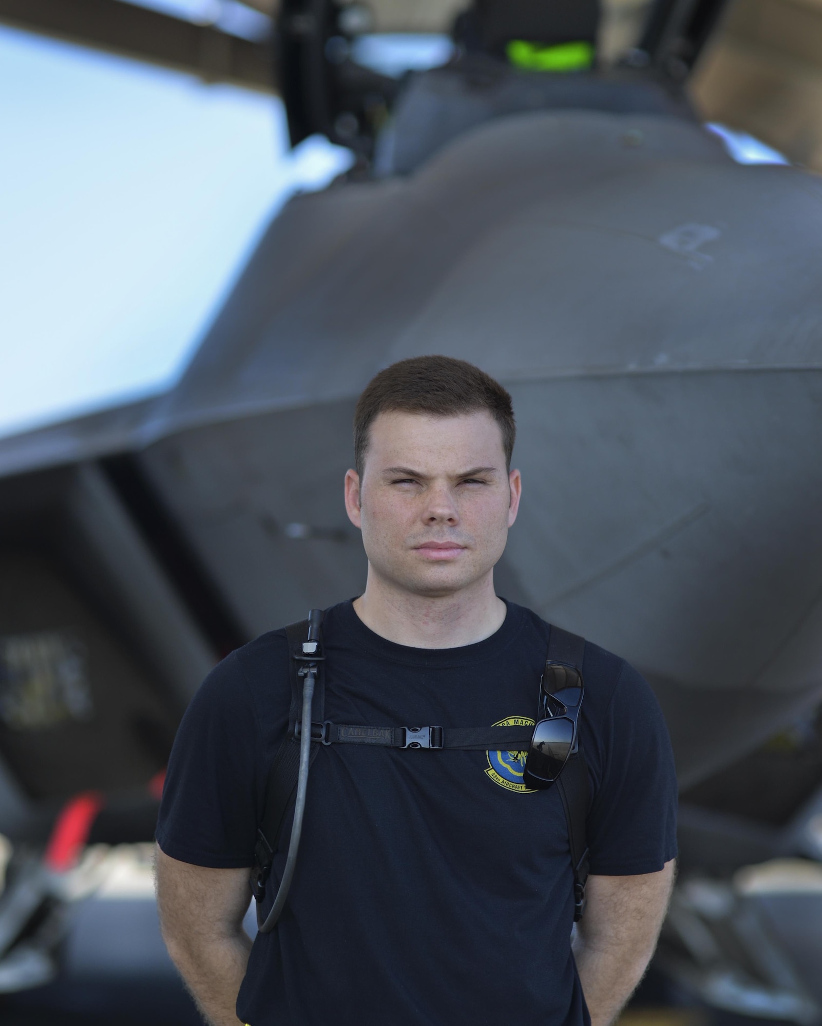 U.S Air Force Senior Airman Samuel Privett, 43rd Aircraft Maintenance Unit weapons load crew member, stands at parade rest in front of an F-22 Raptor at Tyndall Air Force Base, Fla., Nov. 4, 2016. Privett recently led a team of 43rd AMU Airmen to troubleshoot a re-occurring maintenance issue with a Tyndall F-22. Privett ensured accurate communication between multiple work shifts to isolate the issue, and played a key role in developing a cost effective solution. (U.S. Air Force photo by Tech. Sgt. Javier Cruz/Released)