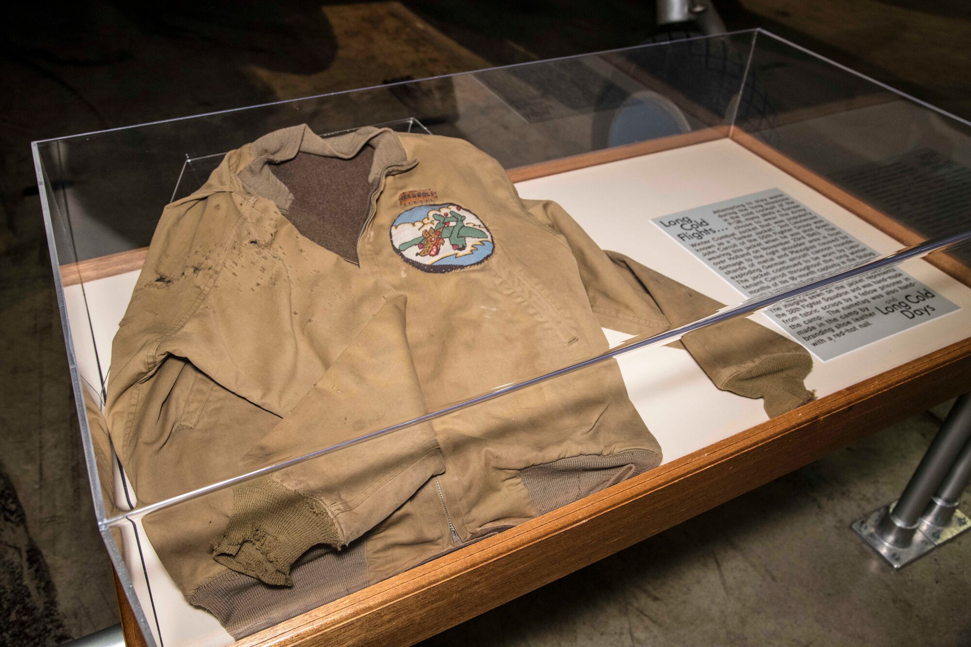 DAYTON, Ohio - 2nd Lt. John Carroll of the 55th Fighter Group was wearing this jacket when he was shot down over Holland on Nov. 23, 1943. This item is on display near the Lockheed P-38L Lightning in the WWII Gallery. (U.S. Air Force photo by Ken LaRock)