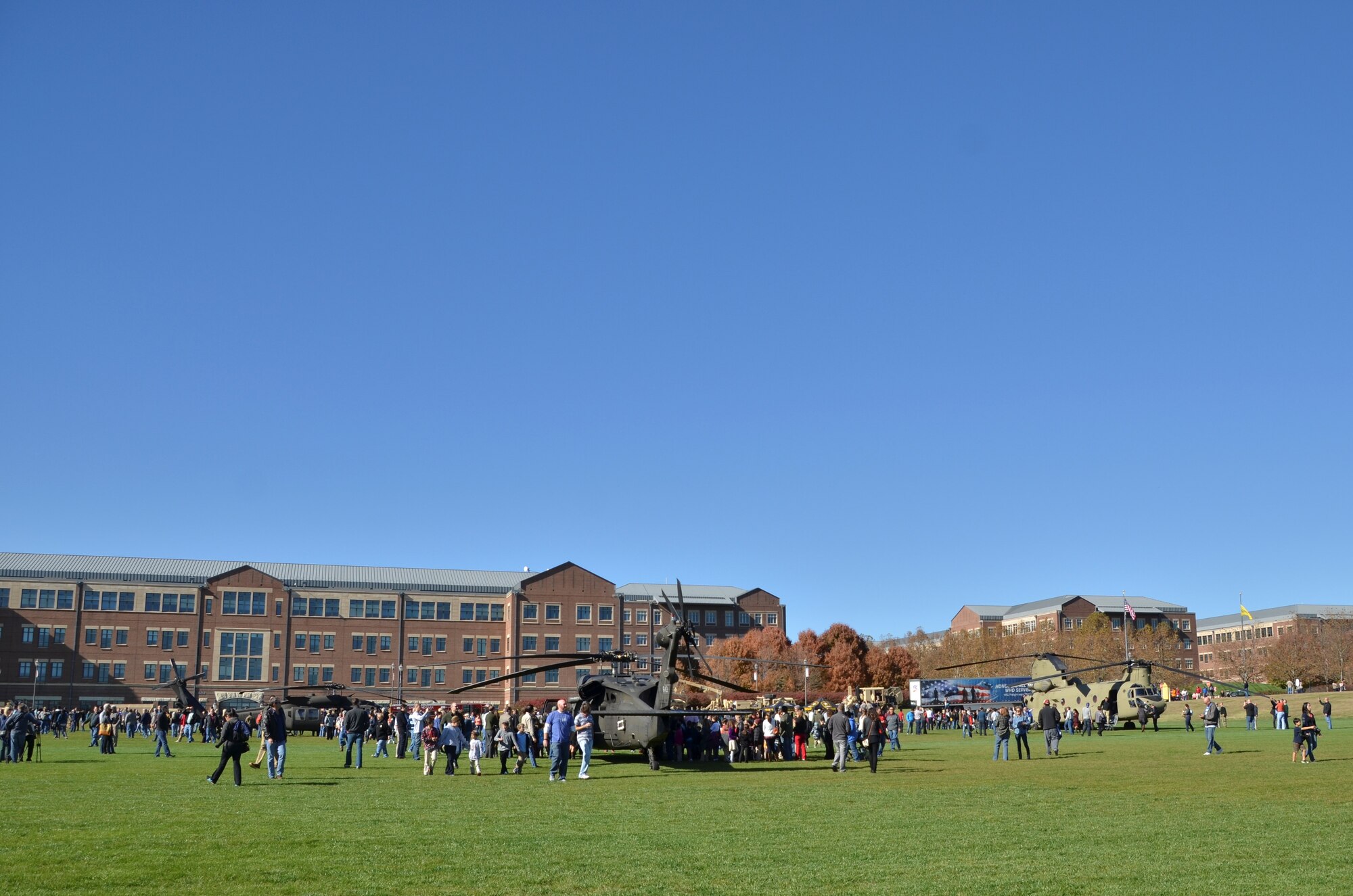 Community members gather on Paige Field at the Sprint Campus in Overland Park, Kan., to thank service members and veterans during the 9th Annual Veterans Day Celebration Nov. 10, 2016. Members of the 442d Fighter Wing joined in the celebration by thanking fellow veterans and providing information about the Air Force Reserve for the public. Other military units from the surrounding area parked military equipment like two UH-60 Blackhawks, a CH-47 Chinook and ground vehicles on the field for people to tour. (U.S. Air Force photo/Senior Airman Missy Sterling)