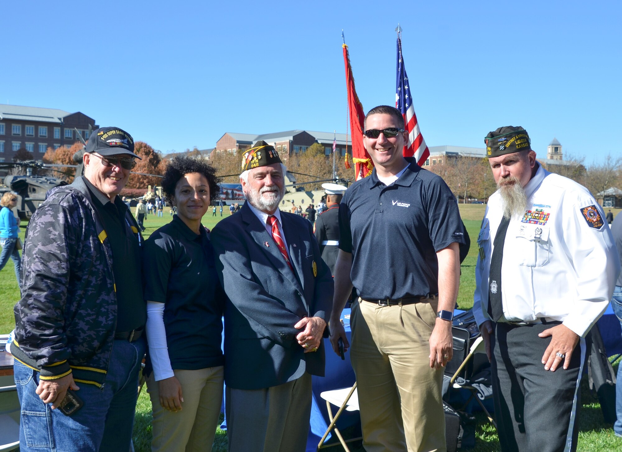 Tech. Sgt. Jessica Harrell and Tech. Sgt. Benjamin Franklin, 442d Fighter Wing recruiters, pose with veterans during the Veterans Day Celebration on Sprint Campus' Paige Field Nov. 10, 2016. The event included an A-10 Thunderbolt II flyover, a U.S. Army band performance and Marine Corps birthday ceremony to celebrate and thank veterans. (U.S. Air Force photo/Senior Airman Missy Sterling)