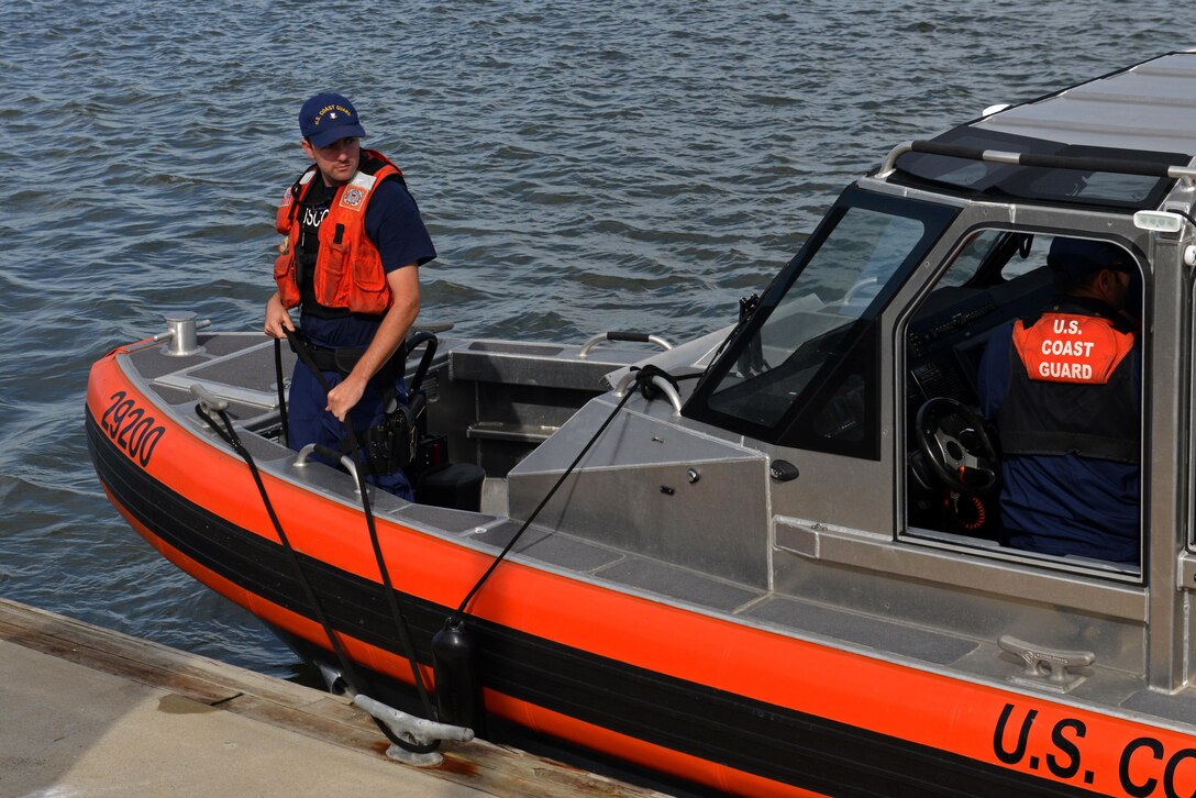A U.S. Coast Guardsman ties up a 29-foot response boat-small at Coast Guard Station Tybee, Ga., Nov. 8, 2016. Coast Guardsmen assigned to Tybee and Coast Guard Station Savannah, Ga., participated in water survival training with 20th Fighter Wing pilots assigned to Shaw Air Force Base, S.C., simulating aircraft ejections and helicopter rescues. (U.S. Air Force photo by Airman 1st Class Destinee Sweeney)