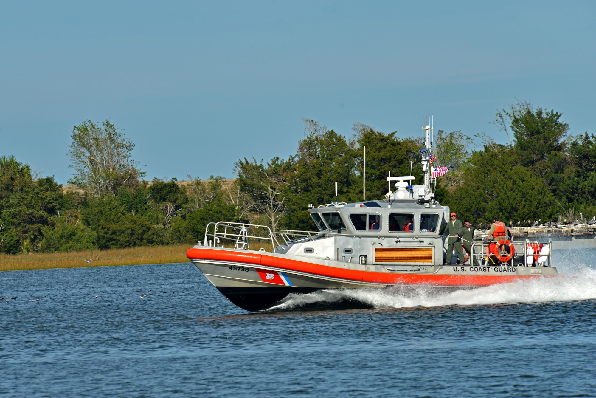 U.S. Airmen and Coast Guardsmen travel toward land on a 45-foot response boat-medium at Coast Guard Station Tybee, Ga., Nov. 8, 2016. In 2013, the Coast Guard saved more than 3,000 people during search and rescue missions. (U.S. Air Force photo by Airman 1st Class Destinee Sweeney)