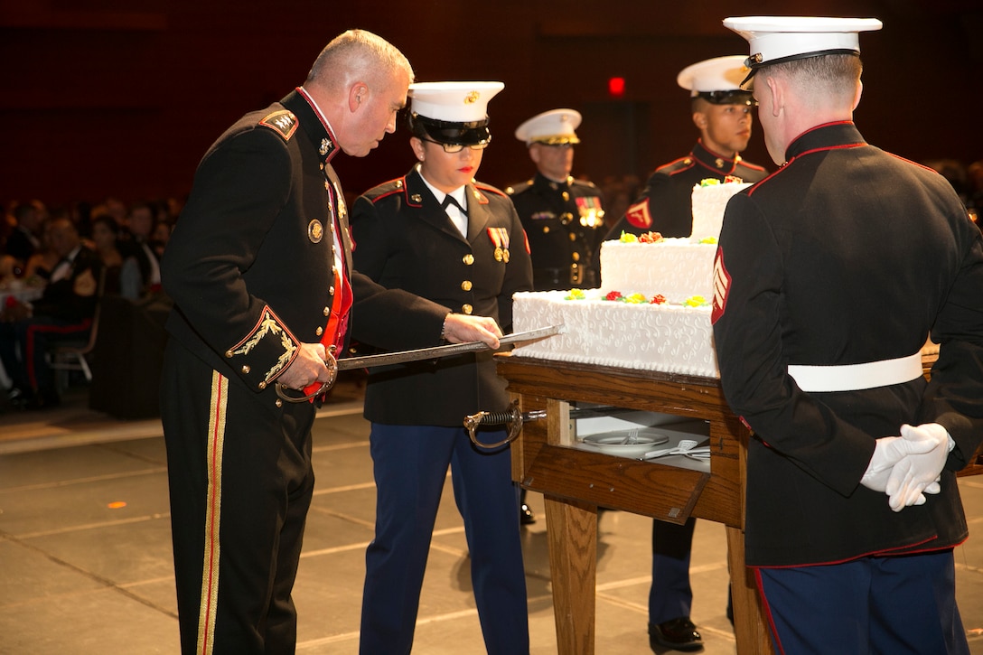Lt. Gen. John Wissler, Commander, U.S. Marine Corps Forces Command, cuts the first piece of cake with an NCO sword during MARFORCOM’s Marine Corps Birthday Ball at the Virginia Beach Convention Center in Virginia Beach, Va., Nov. 5. Marines from the Hampton Roads area gathered for the ball in honor of the Marine Corps' 241st birthday. (Official U.S. Marine Corps photo by Sgt. Kayla D. Rivera/ Released)