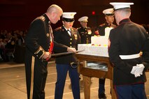 Lt. Gen. John Wissler, Commander, U.S. Marine Corps Forces Command, cuts the first piece of cake with an NCO sword during MARFORCOM’s Marine Corps Birthday Ball at the Virginia Beach Convention Center in Virginia Beach, Va., Nov. 5. Marines from the Hampton Roads area gathered for the ball in honor of the Marine Corps' 241st birthday. (Official U.S. Marine Corps photo by Sgt. Kayla D. Rivera/ Released)