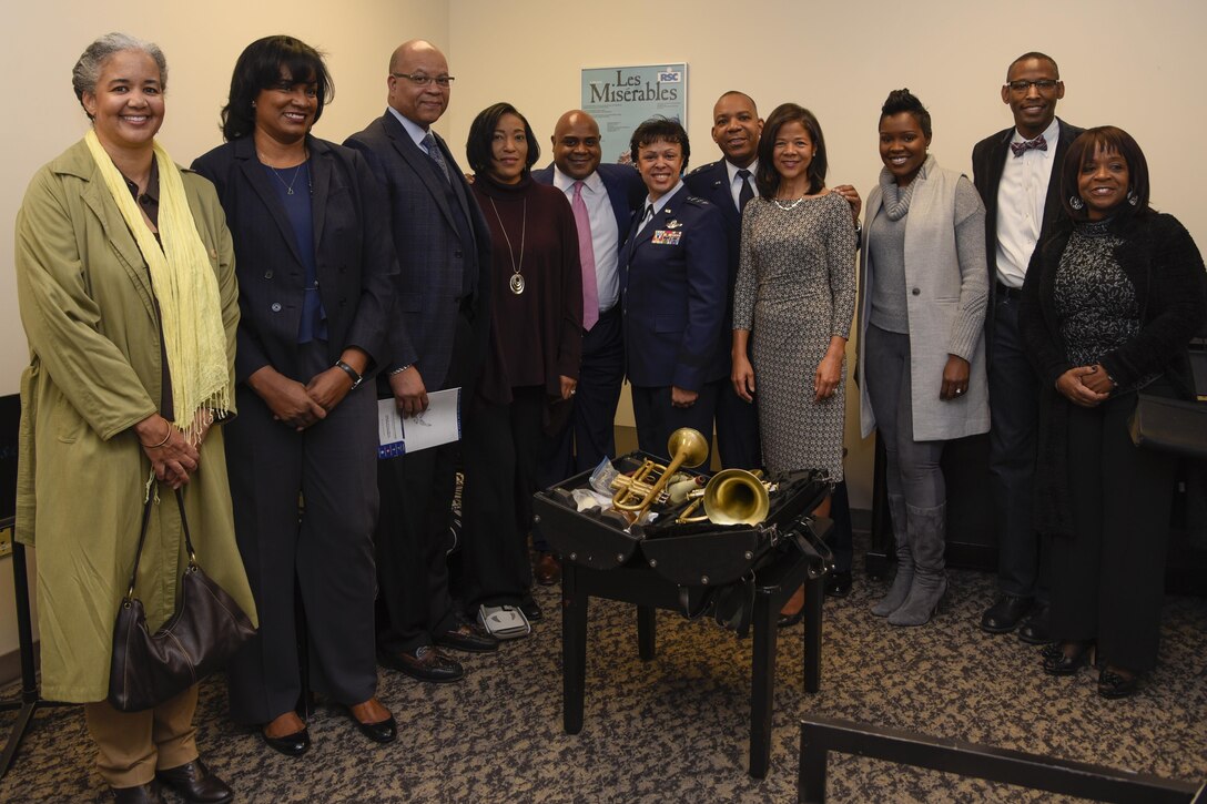 Terell Stanfford, center left, Jazz Heritage Series iconic jazz artist and Lt. Gen. Stayce Harris, center right, Air Force assistant vice chief of staff, and her accompanied guests pose for a group photo in Alexandria, Va., Nov. 11, 2016. Harris met and greeted the jazz artist before their concert. In 1990, the Airmen of Note established the jazz heritage series, featuring the “Note” in concert with legendary icons of jazz. (U.S. Air Force photo by Airman 1st Class Valentina Lopez)