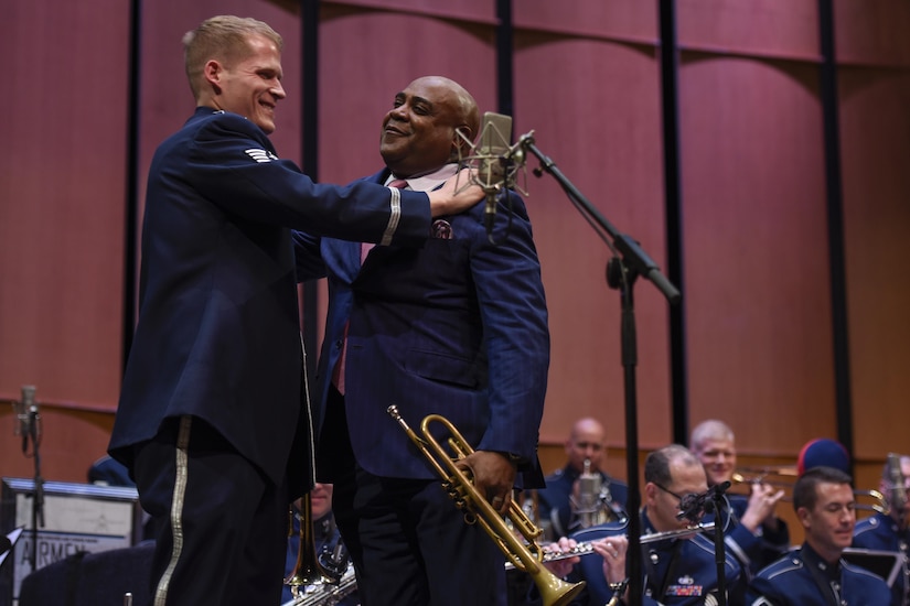 Tech. Sgt. Luke Brandon, Left, Air Force Band trumpeter, and Terell Stanfford, right, jazz trumpeter, embrace in a hug after a duet performance in the Jazz Heritage Series at the Rachel M. Schlesinger Concert Hall in Alexandria, Va., Nov. 11, 2016. Before the Air Force Band, Brandon was a student of Stanfford’s teachings at Temple University. In 1990, the band established the Airmen of Note Jazz Heritage Series that features a legendary jazz artist in concert with the band. (U.S. Air Force photo by Airman 1st Class Valentina Lopez)