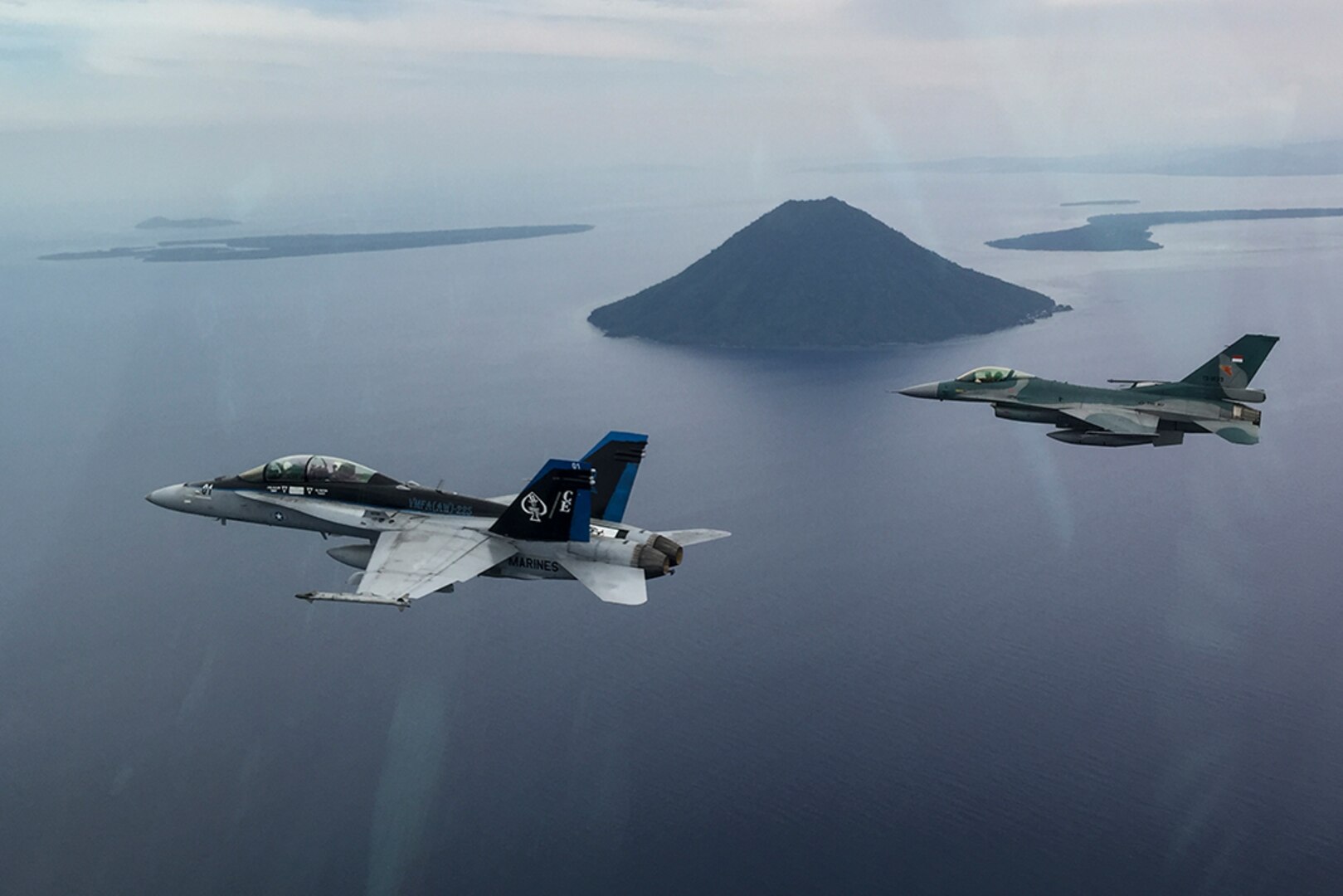 A U.S. Marine Corps F/A-18D Hornet with Marine All-Weather Fighter Attack Squadron (VMFA (AW)) 225 and an Indonesian Air Force F-16 Fighting Falcon fly in formation during exercise Cope West 17 in Indonesia, Nov. 4, 2016. The combined training offered by this exercise helps prepare the U.S. Marine Corps and Indonesia Air Force to work together in promoting a peaceful Indo-Asia-Pacific region while practicing close air support and air-to-air training that will enhance their ability to respond to contingencies throughout the region. Both the U.S. F/A-18D Hornets and Indonesian F-16 Fighting Falcons bring unique capabilities affording the associated nations the opportunity to learn and understand each other’s skills, preparing them for real world contingencies and further strengthening their relationship. 