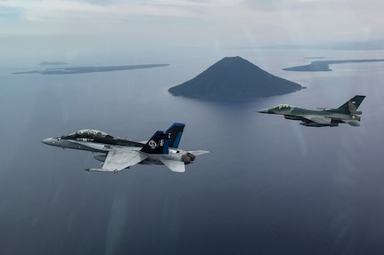 A U.S. Marine Corps F/A-18D Hornet with Marine All-Weather Fighter Attack Squadron (VMFA (AW)) 225 and an Indonesian Air Force F-16 Fighting Falcon fly in formation during exercise Cope West 17 in Indonesia, Nov. 4, 2016. The combined training offered by this exercise helps prepare the U.S. Marine Corps and Indonesia Air Force to work together in promoting a peaceful Indo-Asia-Pacific region while practicing close air support and air-to-air training that will enhance their ability to respond to contingencies throughout the region. Both the U.S. F/A-18D Hornets and Indonesian F-16 Fighting Falcons bring unique capabilities affording the associated nations the opportunity to learn and understand each other’s skills, preparing them for real world contingencies and further strengthening their relationship. 