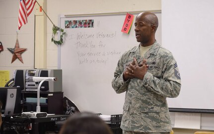 Chief Master Sgt. Marcus Penn, Air Education and Training Command, speaks to students at Stevenson Middle School on Veteran's Day.