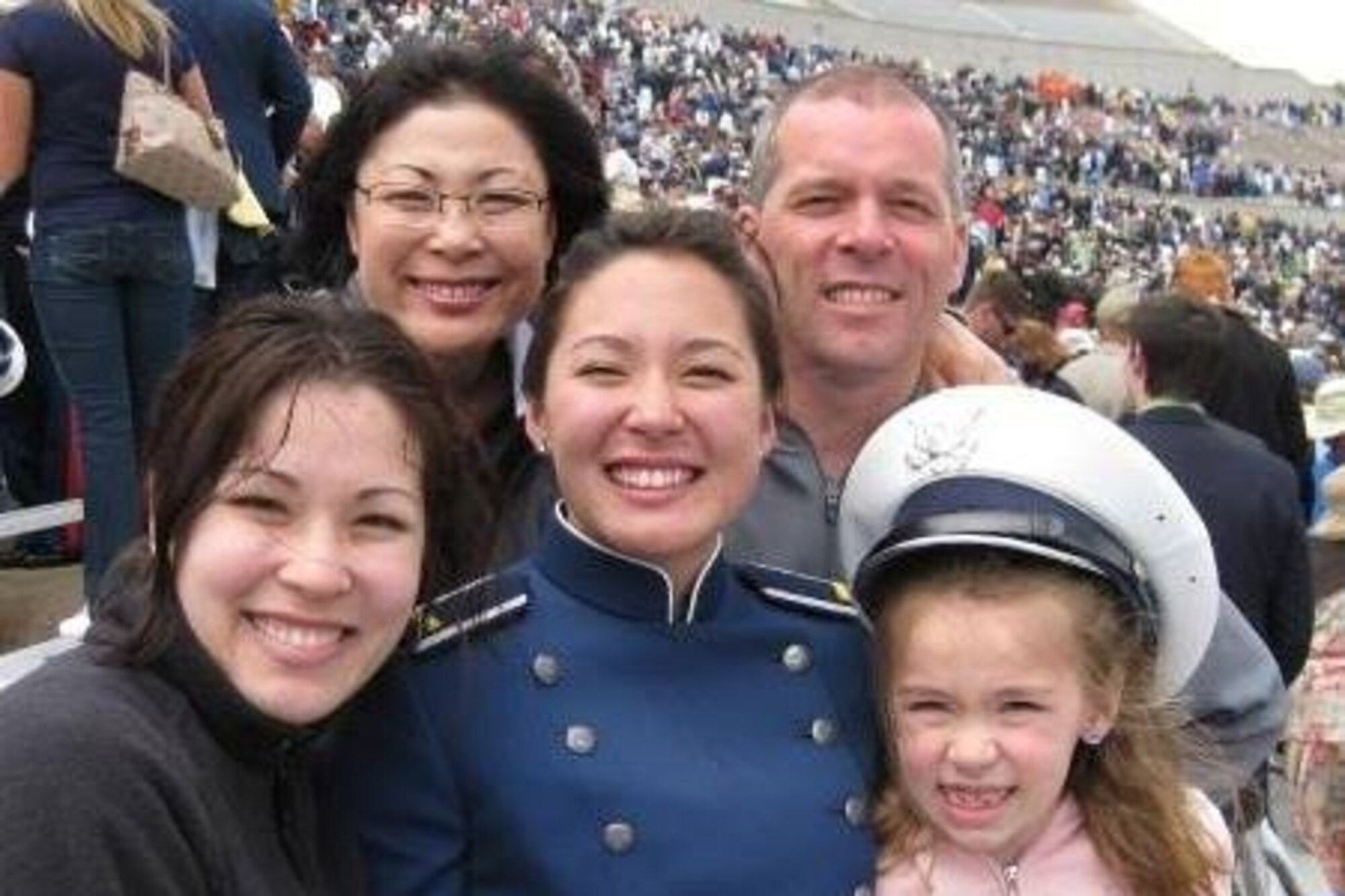 Capt. Deborah A. Gaddis, 509th Weapons Squadron training flight commander and Weapons Instructor Course  instructor, celebrates with her family during her graduation from the United States Air Force Academy in May 2008, at the Falcon Stadium in Colorado Springs, Colorado. Although the Air Force wasn’t Gaddis’ original plan, the camaraderie, academics and scholarships offered by the USAFA were too good to pass up. (Courtesy Photo)