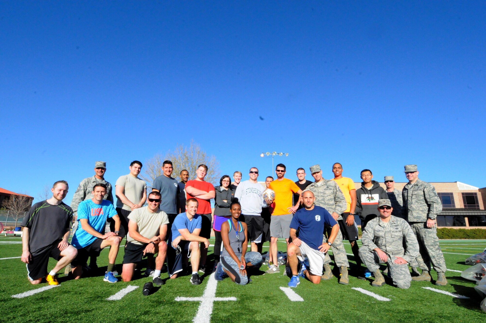 Team Schriever and Team Peterson/Cheyenne Mountain gather after the Combined Federal Campaign Air Force Front Range Knockerball Championship at Peterson Air Force Base, Colorado, Nov. 10, 2016. Both teams won their kick-off installation-level Knockerball games at the beginning of the CFC season. (U.S. Air Force photo/2nd Lt. Darren Domingo)