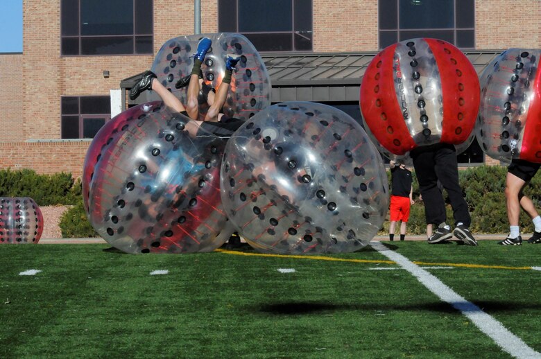 Team Schriever players collide with Team Peterson/Cheyenne Mountain players during the Combined Federal Campaign Air Force Front Range Knockerball Championship at Peterson Air Force Base, Colorado, Nov. 10, 2016. Team Peterson/Cheyenne Mountain won the championship with a come-back victory, beating Schriever 4-3.