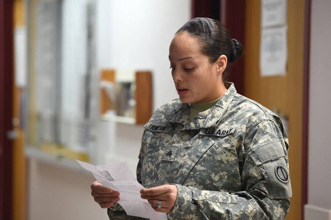 Army Reserve Sgt. Crystal Thompson, Human Resources Sergeant, 85th Support Command, reads remarks during the 85th Support Command's Native American Heritage Observance at their battle assembly weekend, Nov. 9, 2016.
(Photo by Sgt. Aaron Berogan)