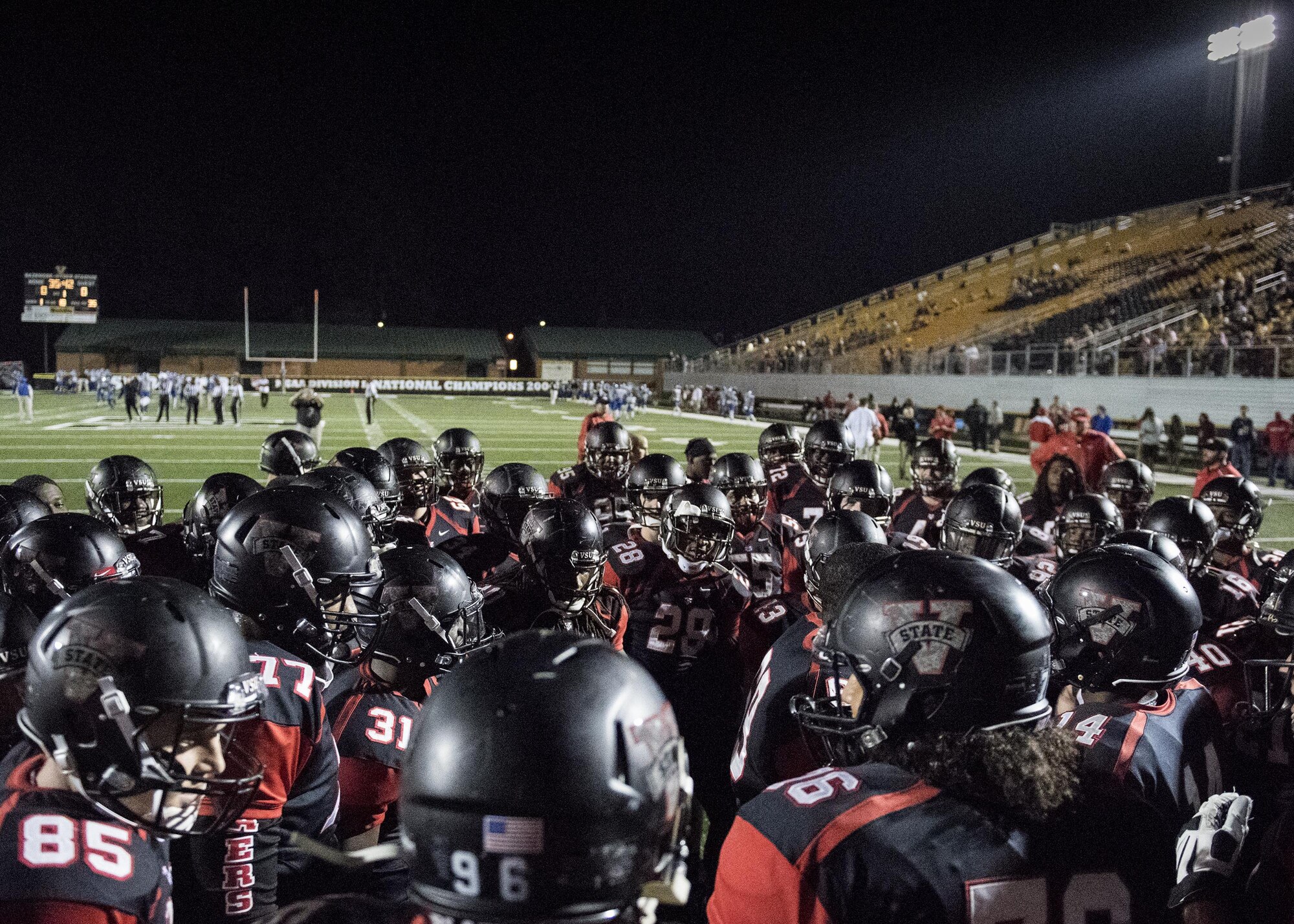 Players from Valdosta State University prepare for the start of a military appreciation game, Nov. 12, in Valdosta, Ga. VSU won with a final score of 44-0 in the last game of their regular season against the Shorter University Hawks. (U.S. Air Force photo by Airman 1st Class Daniel Snider)