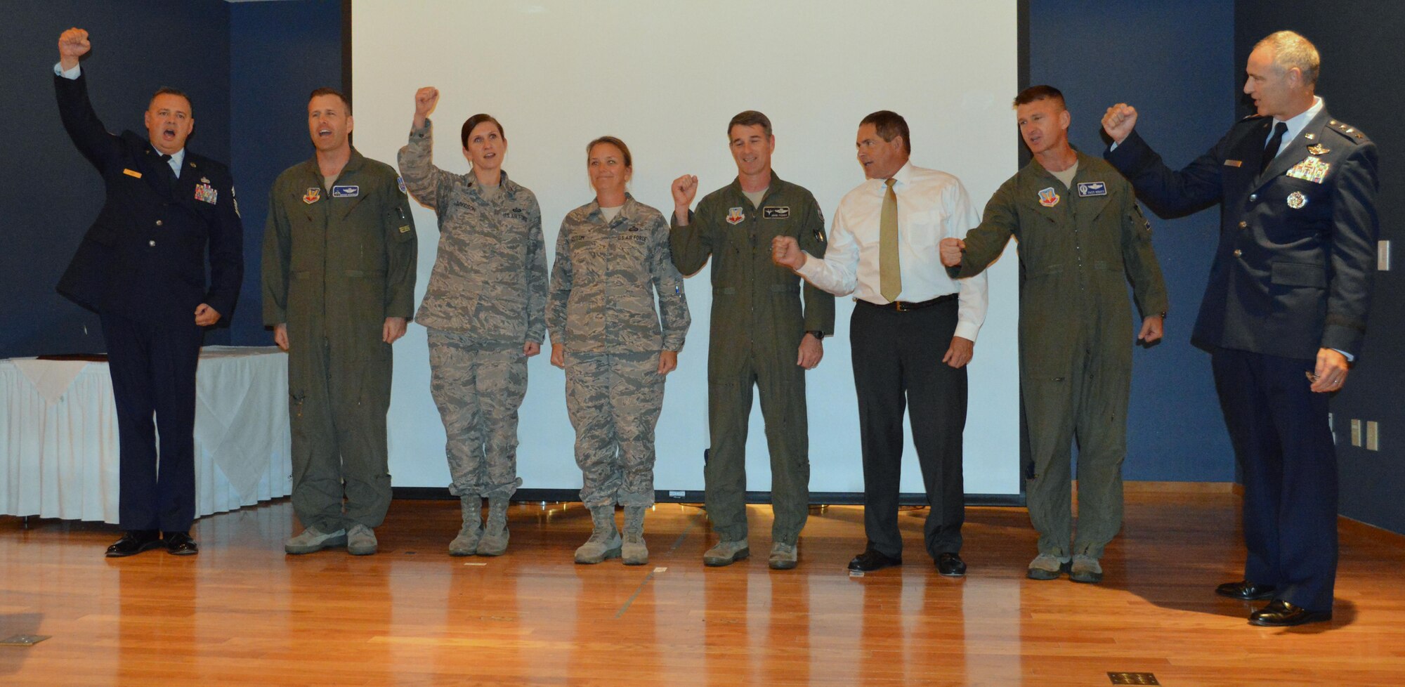 U.S. Air Force Lt. Gen. Scott Williams, Continental U.S. North American Aerospace Defense Command Region and 1st Air Force (Air Forces Northern) Commander, joins senior leadership onstage to close his first commander’s call with the traditional rendition of the Air Force Song. Williams assumed command of the organization in July. (U.S. Air Force photo by Maj. Kat Andrews)