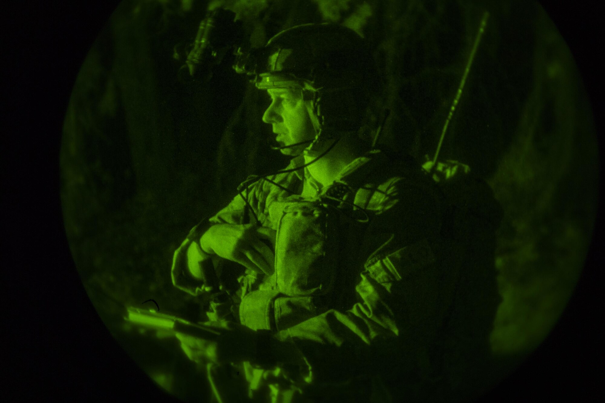 Maj. Michael Hayek, 7th Air Support Operations Squadron director of operations, communicates with an aircraft flying near his location during a surge exercise, Nov. 8, 2016, at Homerville, Ga. During the surge, Moody integrated with various services and units in six locations in the Southeast region. (U.S. Air Force photo by Airman 1st Class Daniel Snider)