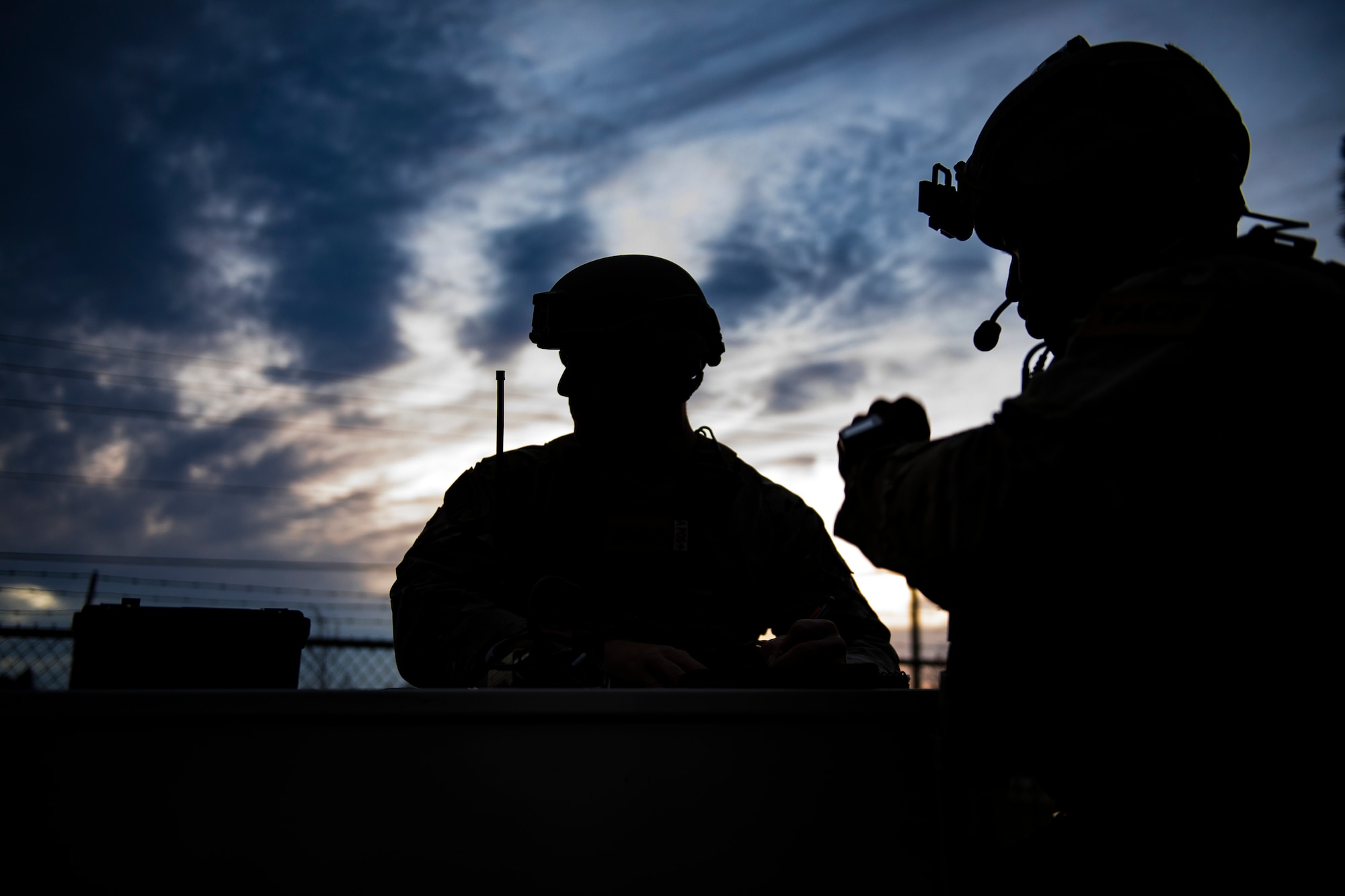 Staff Sgt. Jeffrey Blevins, left, and Senior Airman Parris Holmes, both 7th Air Support Operations Squadron joint terminal attack controllers, await the arrival of aircraft to their location, Nov. 8,2016, at Homerville, Ga. The 7th ASOS was among several Air Force units nationwide assigned to the 93d Air Ground Operations Wing to assist the 23d Fighter Groups’ A-10C Thunderbolt II close-air support flying mission. (U.S. Air Force photo by Airman 1st Class Daniel Snider)