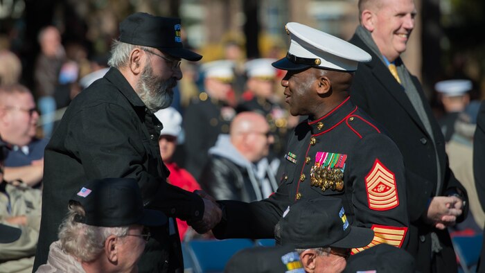 The Sergeant Major of the Marine Corps Sgt. Maj. Ronald L. Green greets a veteran from 2nd Battalion, 9th Marine Regiment during a reunion at the Marine Corps War Memorial in Arlington, Va., Nov. 10, 2016.  Marines from 2/9 have been coming to this reunion since 1984.