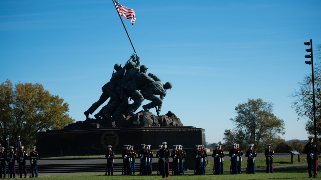 Marines from Marines Barracks Washington form up during a reunion at the Marine Corps War Memorial in Arlington, Va., Nov. 10, 2016. The Marines present a ceremonial wreath to honor the sacrifices of service members in defense of the United States.