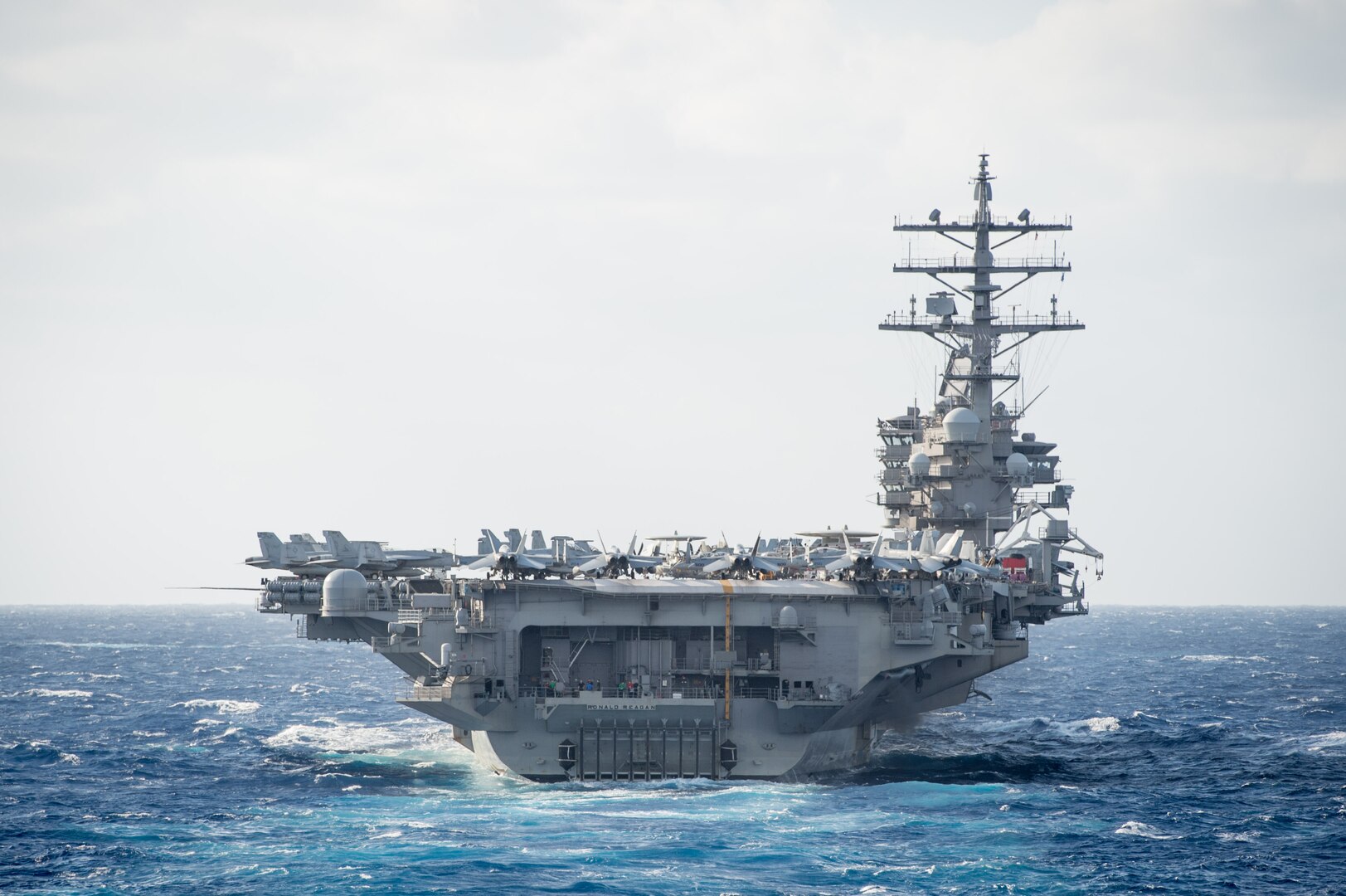 The Nimitz-class aircraft carrier USS Ronald Reagan (CVN 76) steams in formation during a photo exercise (PHOTOEX) to conclude Keen Sword 17 (KS17), Nov. 11, 2016.  KS17 is a biennial, Chairman of the Joint Chiefs of Staff-directed, U.S. Pacific Command-sponsored Field Training Exercise (FTX). KS17 is designed to meet mutual defense objectives by increasing combat readiness and interoperability between Japan Self-Defense Forces (JSDF) and U.S. Forces. Ronald Reagan is leading the Carrier Strike Group Five (CSG 5) patrol in the Philippine Sea supporting security and stability in the Indo-Asia-Pacific region.