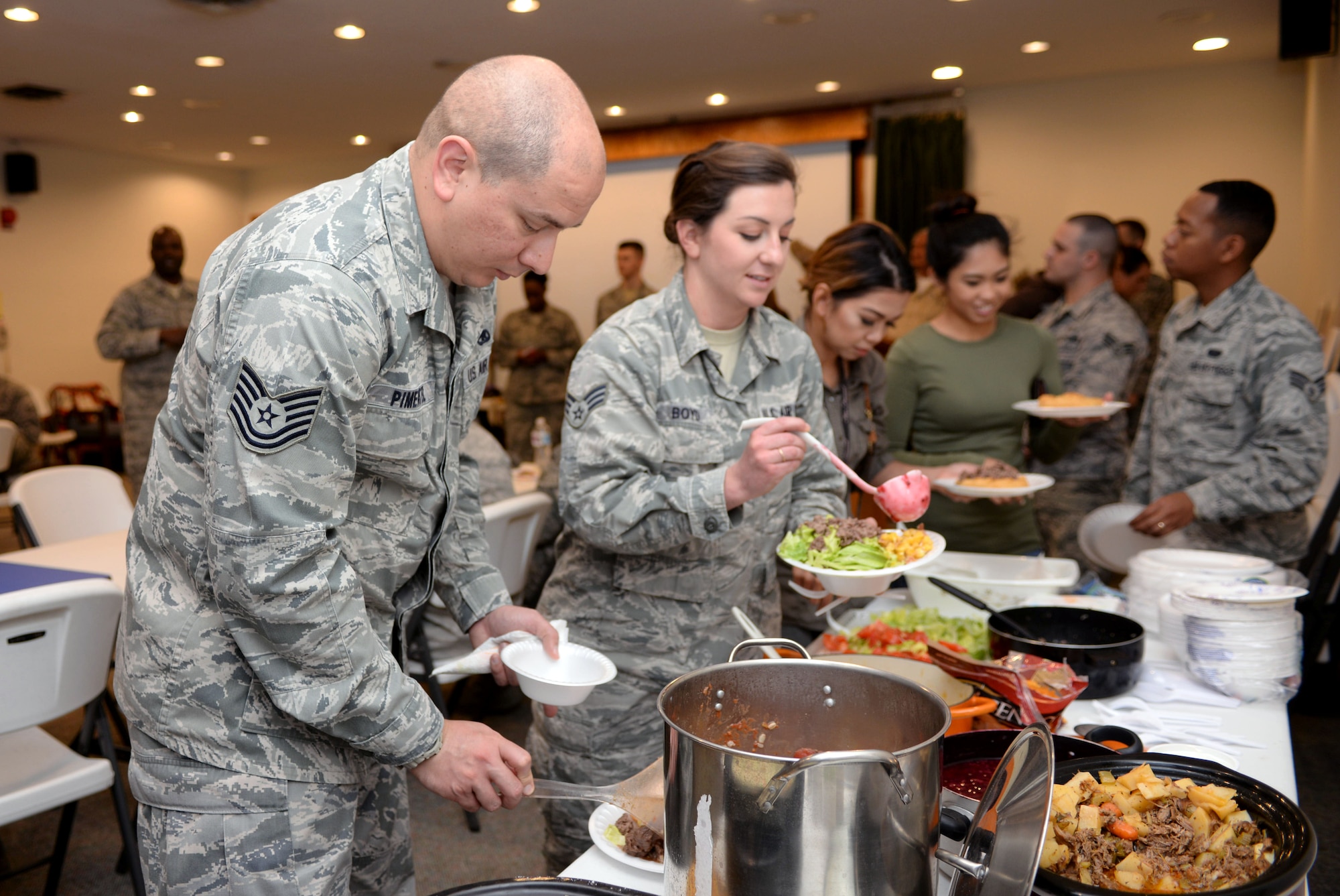 Airmen from the 28th Bomb Wing participate in a food tasting and storytelling event during national Native American Heritage Month at Ellsworth Air Force Base, S.D., Nov. 10, 2016. Many of the dishes served were traditional Native American dishes, including hominy, fry bread, and blue corn mush. (U.S. Air Fore photo by Airman 1st Class Denise M. Jenson)