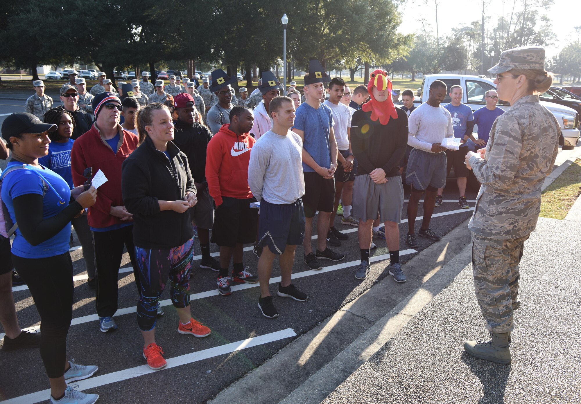 Col. Michele Edmondson, 81st Training Wing commander, delivers remarks to Airmen in front of the headquarters building during the Dragon Week Dragon Hunt Nov. 14, 2016, on Keesler Air Force Base, Miss. The scavenger hunt, consisting of six teams, kicked-off a week filled with resiliency and teambuilding events. (U.S. Air Force photo by Kemberly Groue/Released)