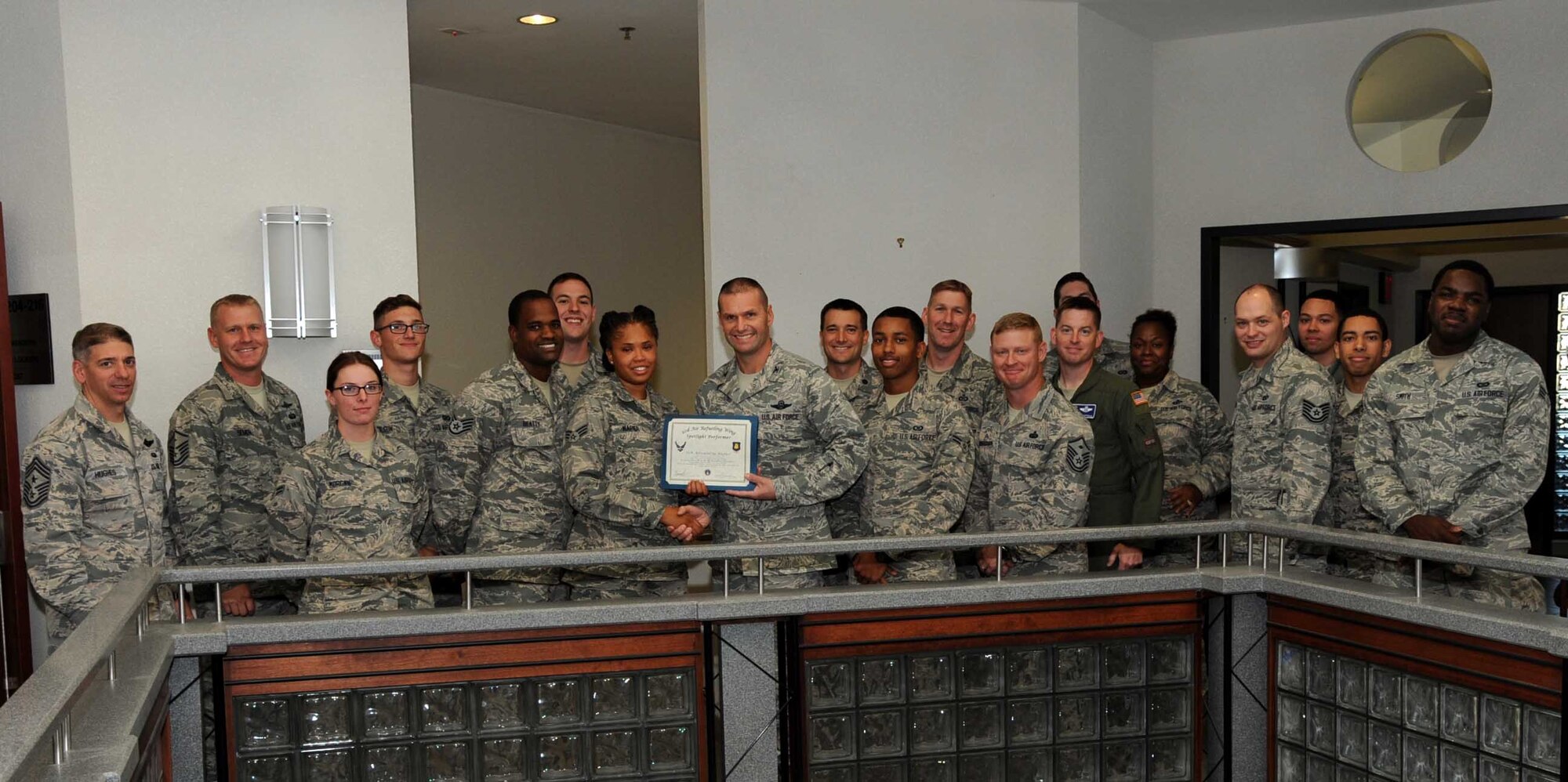 Senior Airman Alexandria Napier, 22nd Operations Support Squadron aviation resource manager, poses with Col. Phil Heseltine, 22nd Air Refueling Wing vice commander, Nov. 9, 2016, at McConnell Air Force Base, Kan. Napier received the spotlight performer for the week of Oct. 24-28. (U.S. Air Force photo/Airman 1st Class Jenna K. Caldwell) 