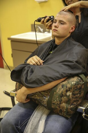 A recruit from Bravo Company, 1st Recruit Training Battalion, receive their initial haircut at Marine Corps Recruit Depot San Diego, Nov. 7. Recruits receive haircuts immediately after arriving to create uniformity. Annually, more than 17,000 males recruited from the Western Recruiting Region are trained at MCRD San Diego. Bravo Company is scheduled to graduate Feb. 3.