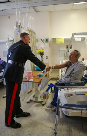 Brigadier General William M. Jurney, commanding general, Marine Corps Recruit Depot San Diego/Western Recruiting Region, shakes the hand of a veteran at the Veterans Affairs San Diego Healthcare System, Nov. 7. Jurney took part in a cake cutting ceremony in celebration of the Marine Corps’ 241st birthday, which is Nov. 10, 1775.