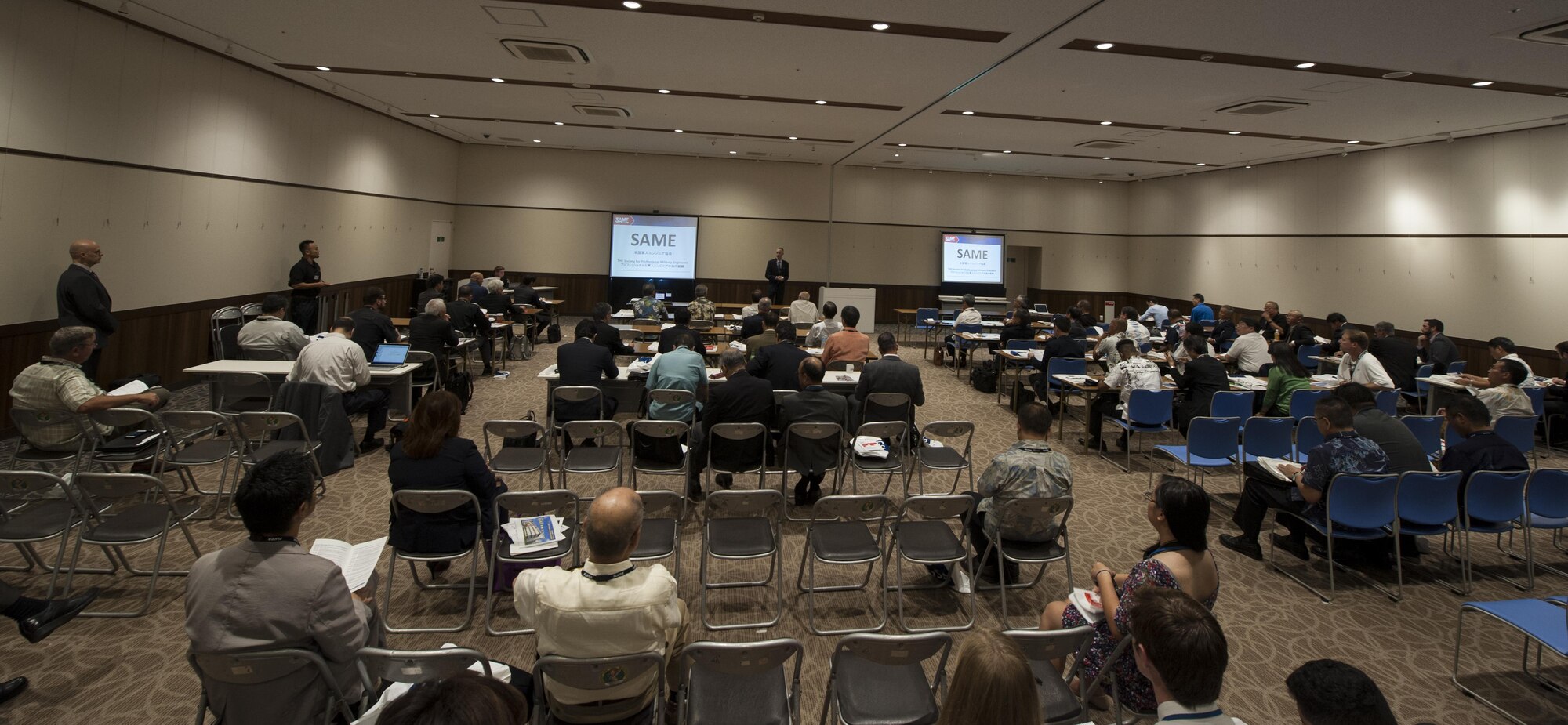 U.S. Air Force Col. Robert Grainger, 18th Civil Engineer Group commander, speaks to local and military engineers during the Society of American Military Engineers Japan Post symposium Nov. 7, 2016, in Okinawa, Japan. The SAME Japan Post strive to have meetings similar to a symposium to maintain frequent communication between military and local engineers. (U.S. Air Force photo by Senior Airman Lynette M. Rolen/Released)