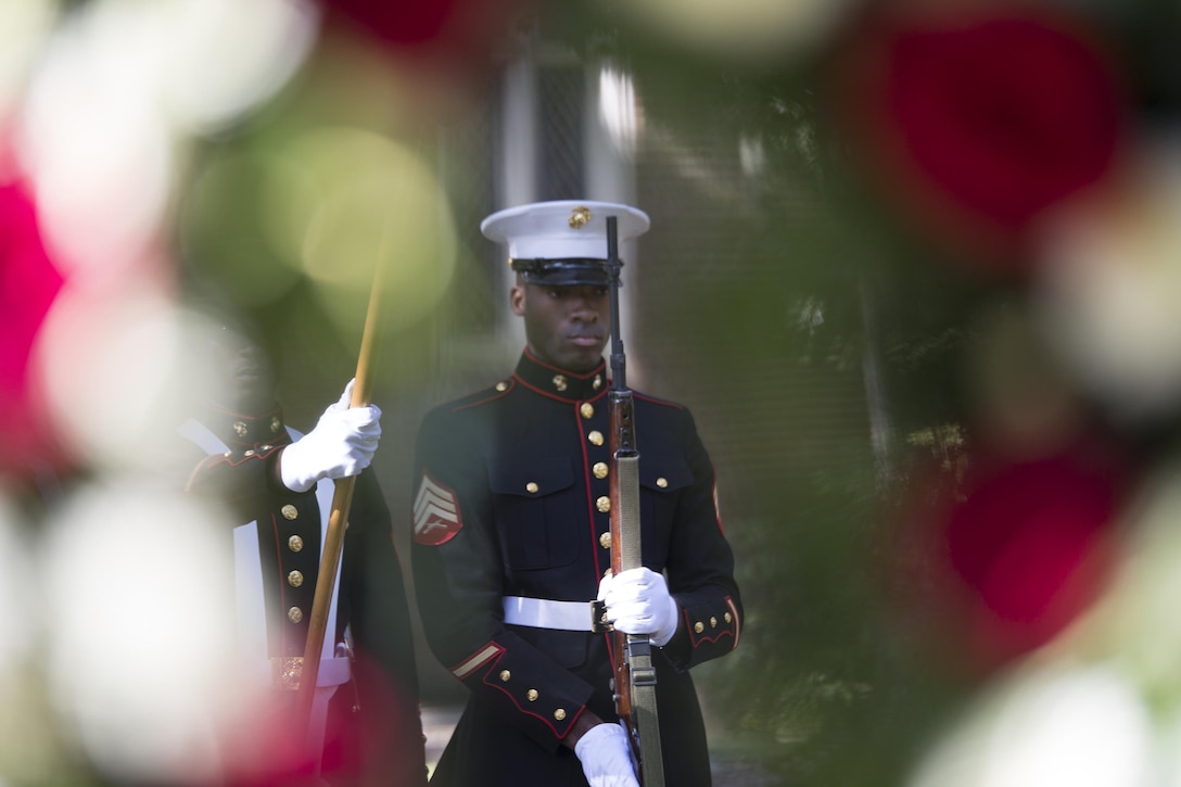Sgt. Joshua A. Pineset, security administrative noncommissioned officer in charge, Marine Forces Reserve, presents his rifle during a wreath-laying at the gravesite of Gen. Robert H. Barrow, 27th Commandant of the Marines Corps, at Grace Church of West Feliciana Cemetery in St. Francisville, La., Nov. 10, 2016. The Marines lay the wreath at Barrow’s final resting to honor 41 years of his distinguished service and to remember his contribution to the Corps. (U.S. Marine Corps photo by Sgt. Sara Graham/released) 