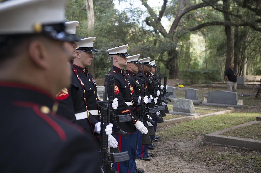 A rifle team of Marines from Truck Company, 23rd Marine regiment, 4th Marine Division, present arms during a wreath-laying ceremony at the gravesite of Gen. Robert H. Barrow, 27th Commandant of the Marines Corps, at Grace Church of West Feliciana Cemetery in St. Francisville, La., Nov. 10, 2016. The Marines lay the wreath at Barrow’s final resting place each year to honor his contributions to the Marine Corps. (U.S. Marine Corps by Sgt. Sara Graham/released) 