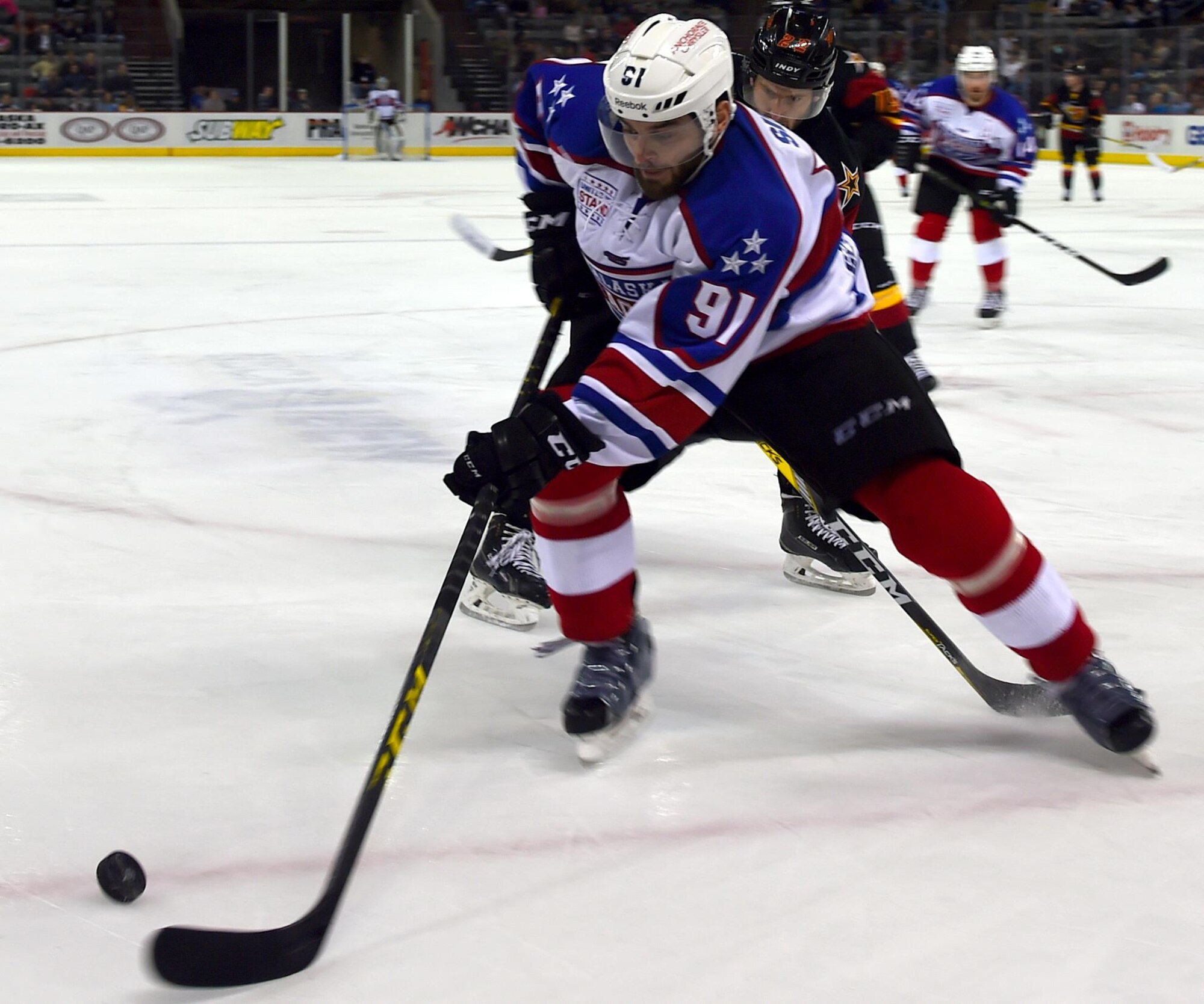 Alaska Aces right wing Peter Sivak controls the puck during a military appreciation game against the Indianapolis Fuel, at Sullivan Arena in Anchorage, Alaska, Nov. 11, 2016. The Alaska Aces honored veterans for their service with a military appreciation weekend Nov. 11 and 12. 