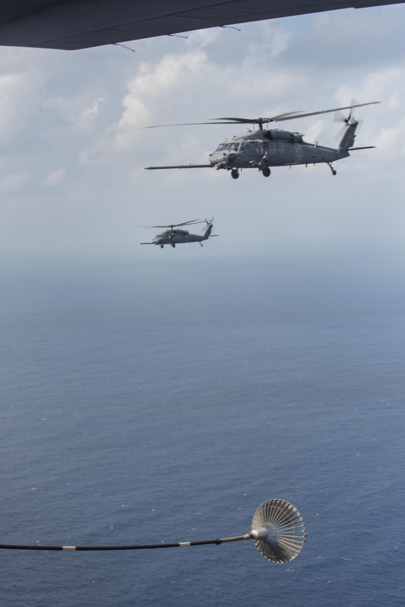 An MC-130H Combat Talon II from the 1st Special Operations Squadron refuels an HH-60 Pave Hawk from the 943rd Rescue Group during Exercise Keen Sword 17 Nov. 7, 2016, near Okinawa, Japan. Approximately 11,000 U.S. personnel will participate in KS17, including those assigned to U.S. Forces Japan Headquarters, 5th Air Force, U.S. Naval Forces Japan, U.S. Army Japan, III Marine Expeditionary Force and Amphibious Force 7th Fleet. (U.S. Air Force photo by Airman 1st Class Corey M. Pettis)