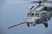 An MC-130H Combat Talon II from the 1st Special Operations Squadron refuels an HH-60 Pave Hawk from the 943rd Rescue Group during Exercise Keen Sword 17 Nov. 7, 2016, near Okinawa, Japan. Significant training activities during Keen Sword 17 include air and sea operations, integrated air and missile defense and ballistic missile defense in order to keep pace with the growing ballistic missile threat in the Indo-Asia-Pacific region. (U.S. Air Force photo by Airman 1st Class Corey M. Pettis)