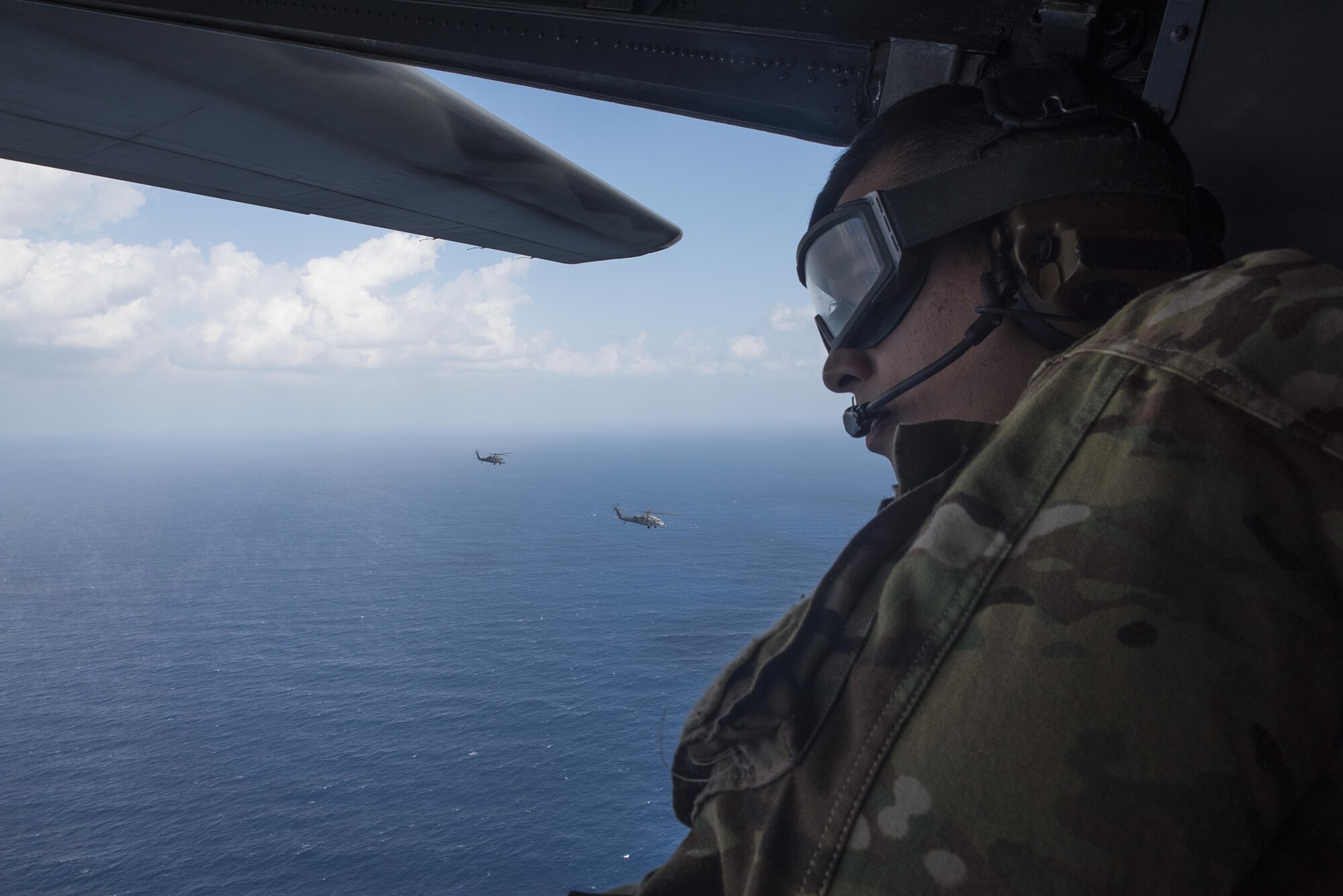 A loadmaster from the 1st Special Operations Squadron looks out of the back of an MC-130H Combat Talon II during Exercise Keen Sword 17 Nov. 7, 2016, near Okinawa, Japan. The Indo-Asia-Pacific region holds the majority of the world’s people and trade, and the Japan-U.S. alliance is the bedrock of peace, security and prosperity in this region. Exercises like Keen Sword are a decisive demonstration of the strength of the friendship between our people. (U.S. Air Force photo by Airman 1st Class Corey M. Pettis)