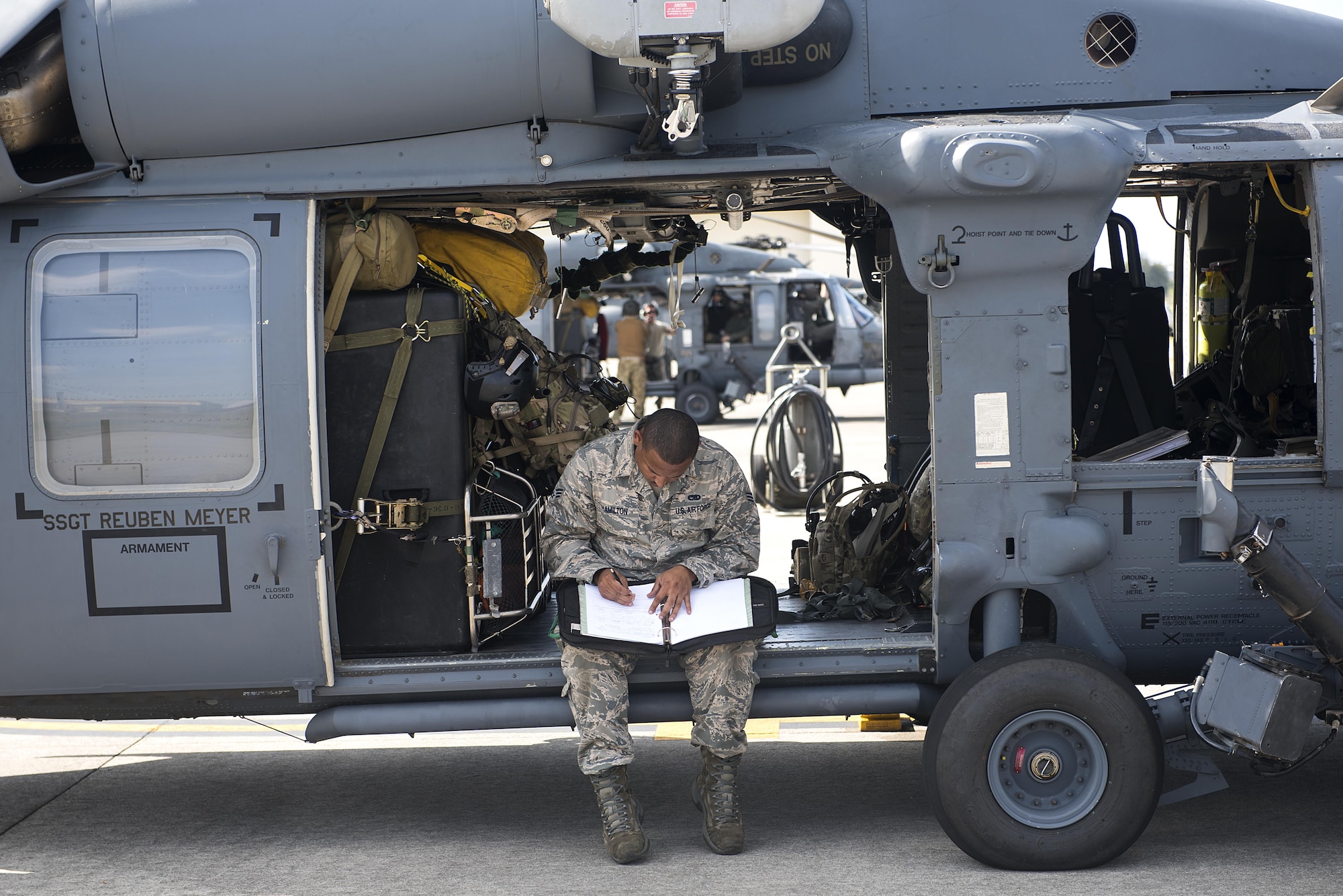 U.S. Air Force Senior Airman Esrick Hamilton, a maintainer from the 33rd Helicopter Maintenance Unit, prepares an HH-60 Pave Hawk for take-off during Exercise Keen Sword 17 Nov. 8, 2016, at Kadena Air Base, Japan. Approximately 11,000 U.S. personnel will participate in KS17, including those assigned to U.S. Forces Japan Headquarters, 5th Air Force, U.S. Naval Forces Japan, U.S. Army Japan, III Marine Expeditionary Force and Amphibious Force 7th Fleet. (U.S. Air Force photo by Airman 1st Class Corey M. Pettis)