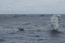 A Japan Air Self-Defense Force pararescueman parachutes into the ocean during Exercise Keen Sword 17 Nov. 10, 2016, at Kadena Air Base, Japan. The U.S. and Japan have been conducting Keen Sword since 1986. (U.S. Air Force photo by Airman 1st Class Corey M. Pettis)