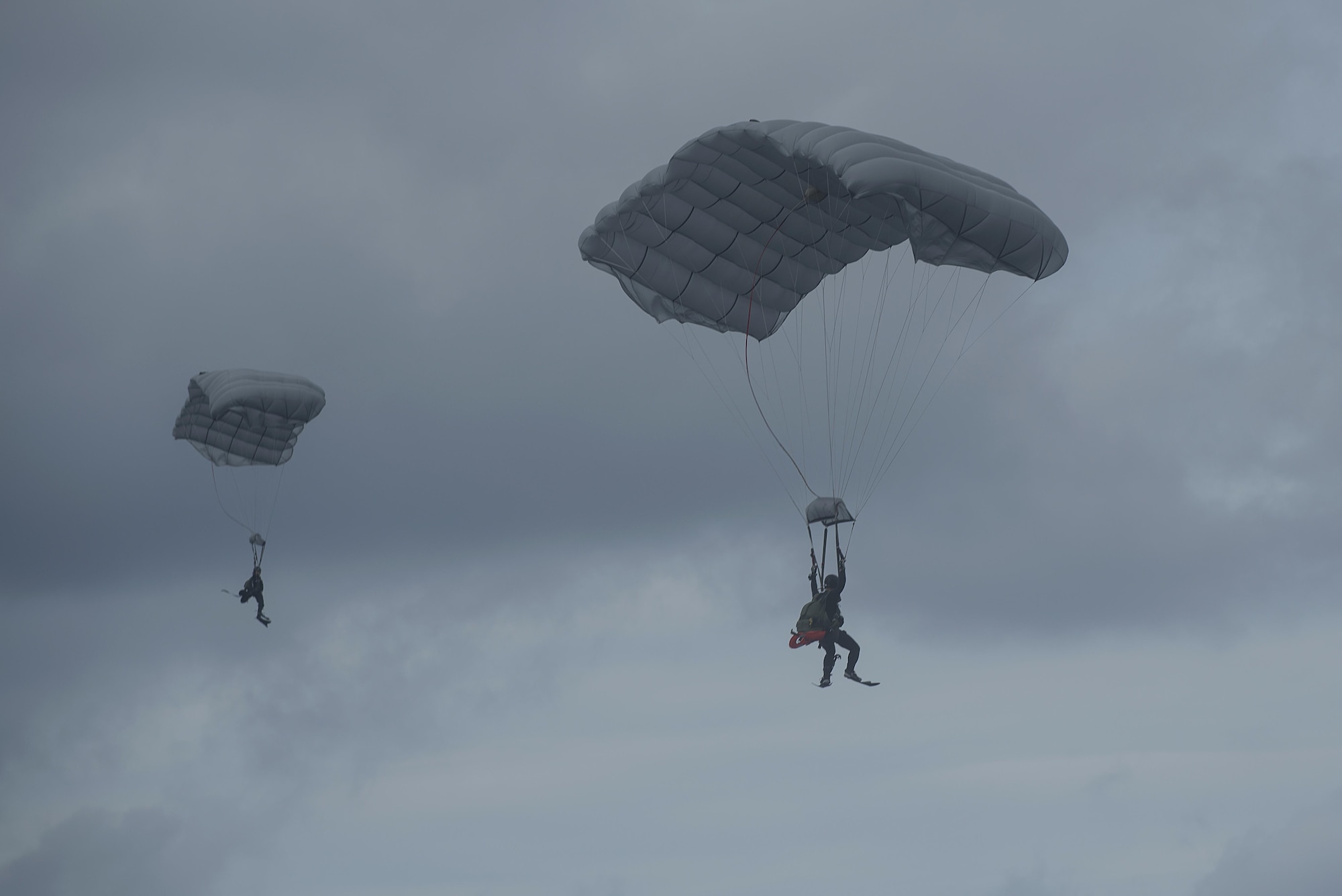 Japan Air Self-Defense Force pararescuemen parachute into the ocean during Exercise Keen Sword 17 Nov. 10, 2016, at Kadena Air Base, Japan. JASDF and 31st Rescue Squadron Pararescuemen conducted a mass casualty exercise, practicing rescuing survivors of an aircraft crash in open ocean. (U.S. Air Force photo by Airman 1st Class Corey M. Pettis)