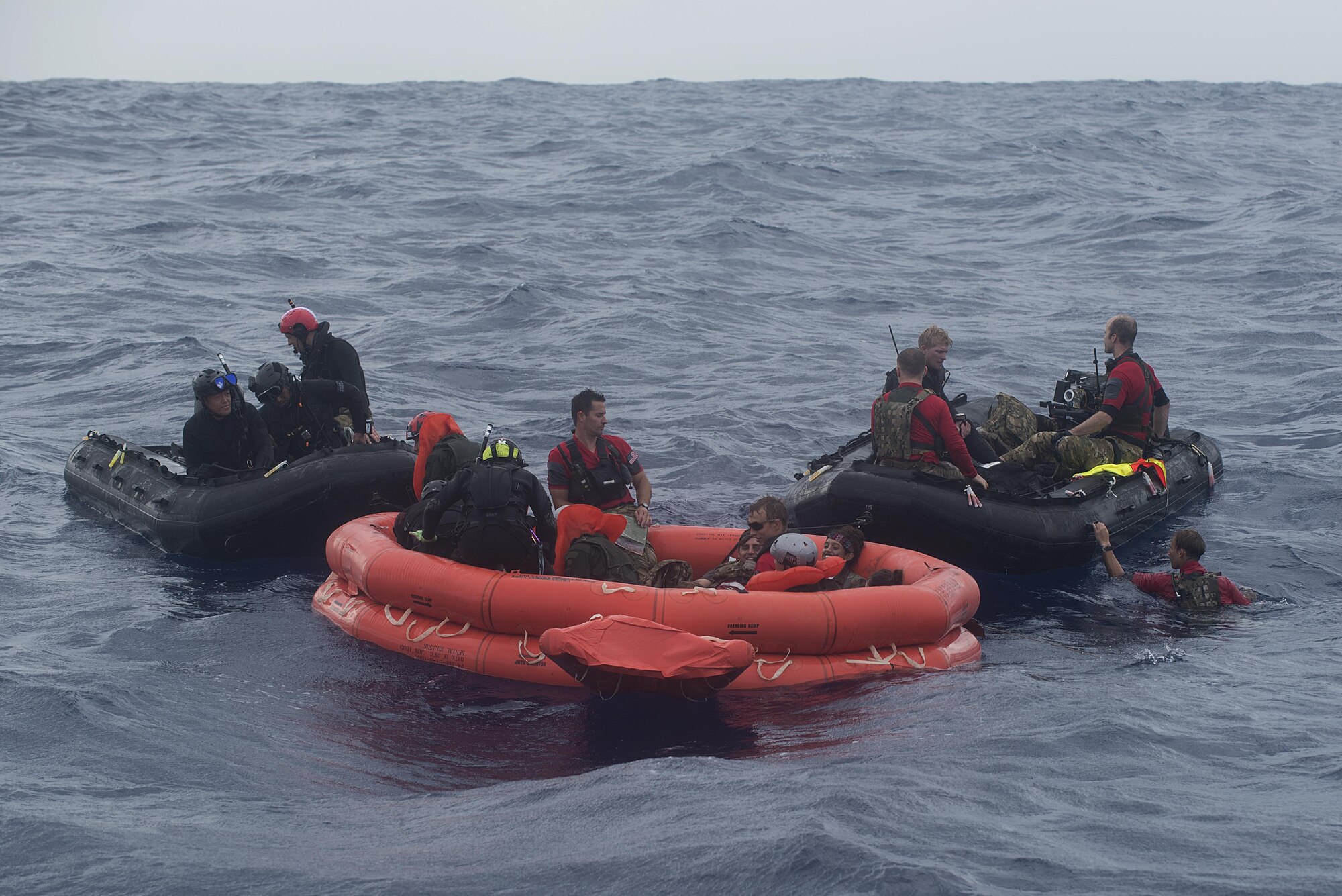 Japan Air Self-Defense Force and 31st Rescue Squadron pararescuemen rescue survivors of a simulated aircraft crash during Exercise Keen Sword 17 Nov. 10, 2016, near Okinawa, Japan. The survivors were pulled off the raft and later hoisted up into rescue helicopters. (U.S. Air Force photo by Airman 1st Class Corey M. Pettis)