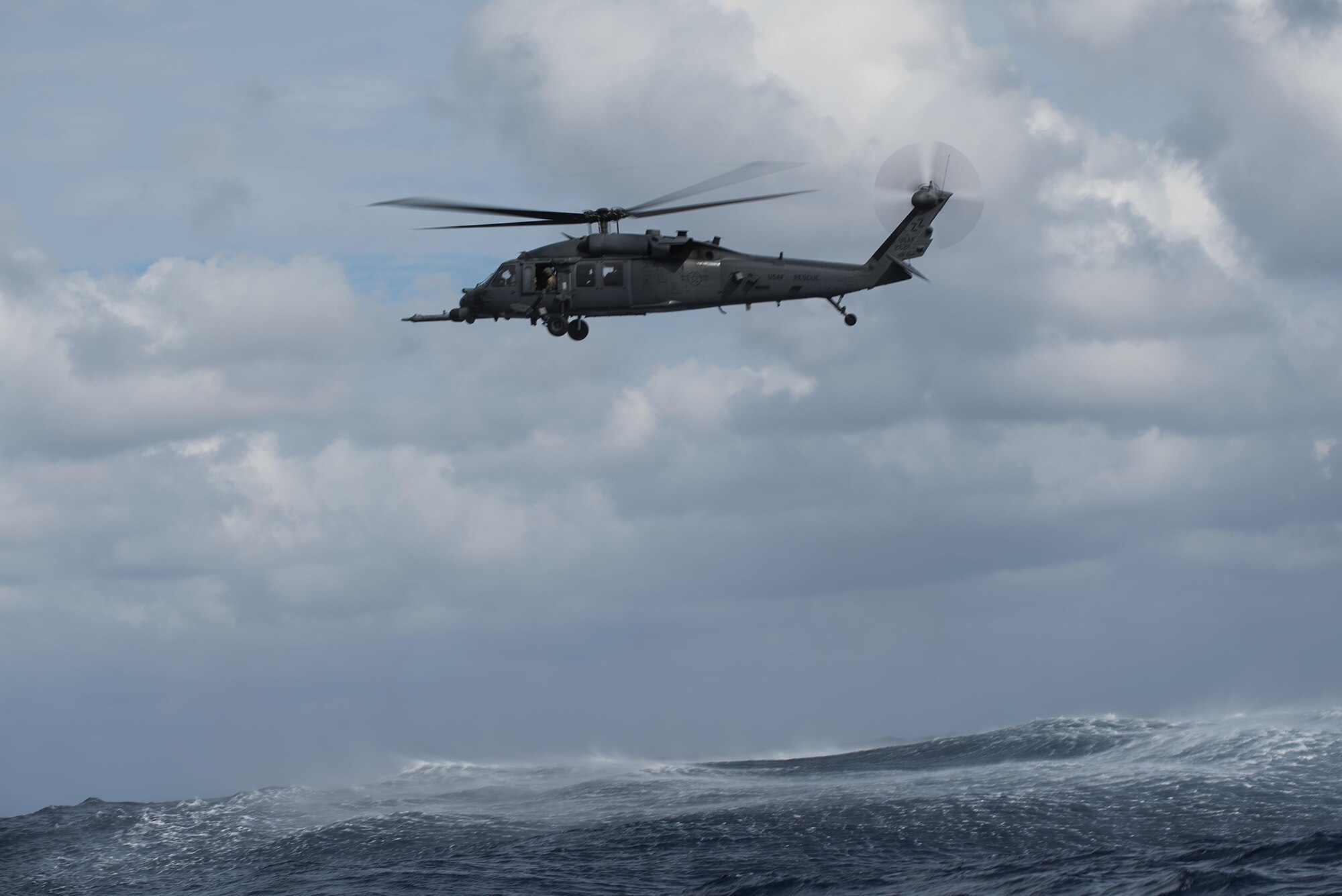 An HH-60 Pave Hawk from the 33rd Rescue Squadron waits to pick up simulated survivors during Exercise Keen Sword 17 Nov. 10, 2016, near Okinawa, Japan. The exercise is designed to increase combat readiness and interoperability within the framework of the U.S.-Japan alliance. (U.S. Air Force photo by Airman 1st Class Corey M. Pettis)