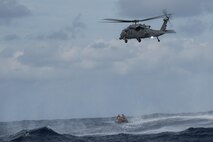 An HH-60 Pave Hawk from the 33rd Rescue Squadron waits to pick up simulated survivors during Exercise Keen Sword 17 Nov. 10, 2016, near Okinawa, Japan. The mass casualty portion of the exercise demonstrated partnership with Japan Air Self-Defense Force Rescue Squadrons as they worked with their U.S. counterparts to evacuate simulated survivors. (U.S. Air Force photo by Airman 1st Class Corey M. Pettis)