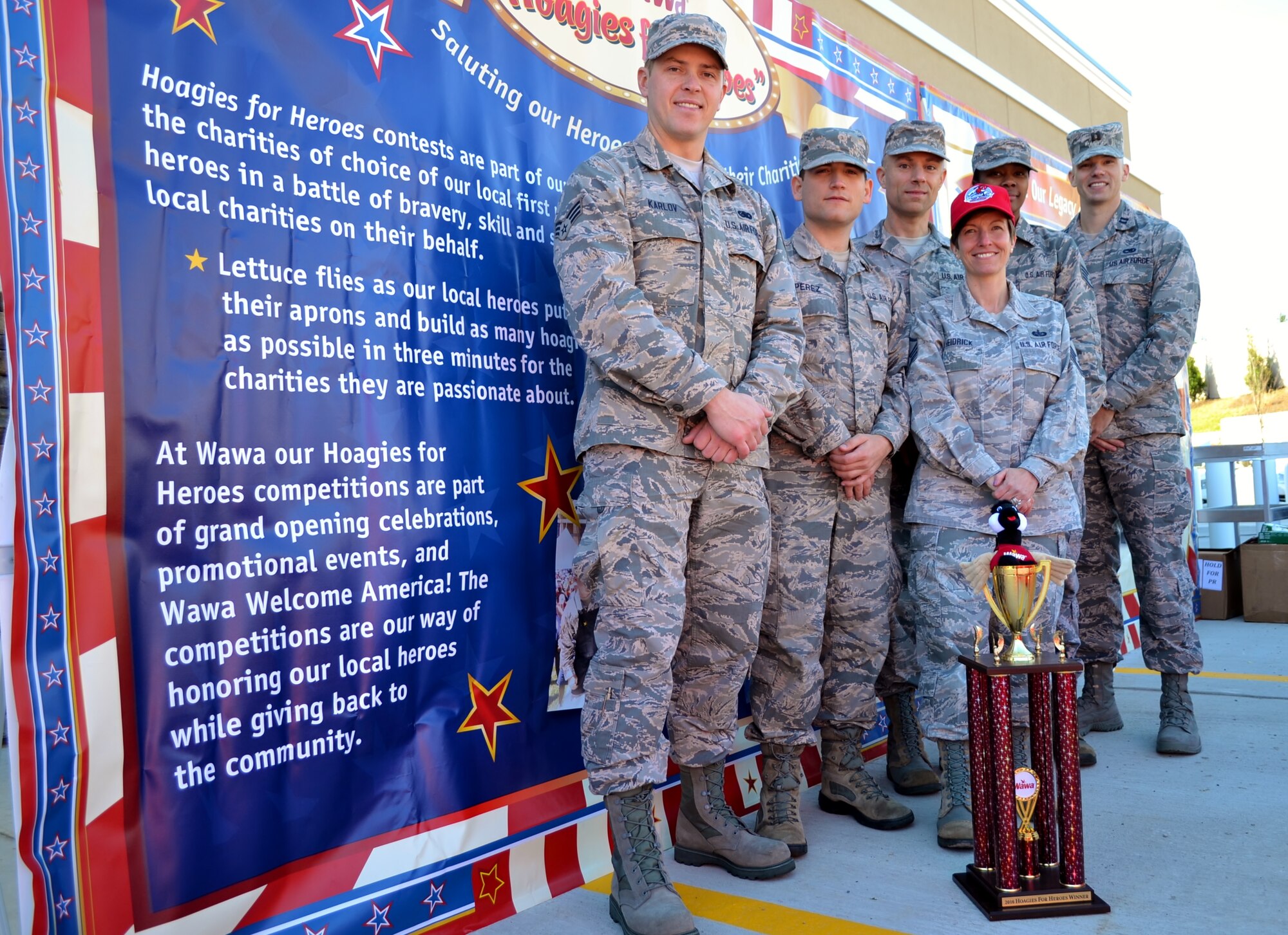 An Air National Guard team from the 111th Attack Wing at Horsham Air Guard Station, Pa., stands with the first-place trophy they won at a hoagie-building competition for the Liberty USO in an event hosted by Wawa Inc., in Cheltenham, Pa., Nov. 10, 2016. Wawa’s USO-supported hoagie building competitions have become a 111th ATKW morale and charitable staple for the past few years. (U.S. Air National Guard photo by Tech. Sgt. Andria Allmond)