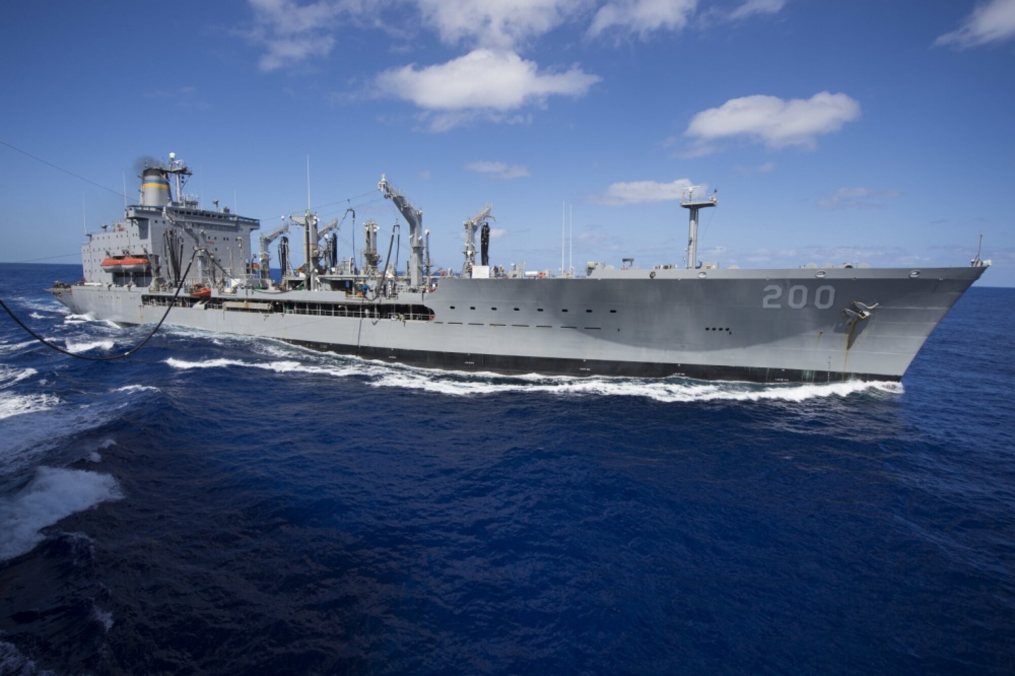 The Military Sealift Command fleet replenishment oiler USNS Guadalupe (T-AO 200) sends fuel to the dock landing ship USS Comstock (LSD 45) during a replenishment at sea. Comstock, part of the Makin Island Amphibious Ready Group, and the embarked 11th Marine Expeditionary Unit are returning to homeport San Diego following a seven-month deployment to the Western Pacific and the U.S. Central Command areas of operation. (U.S. Navy photo by Mass Communication Specialist 3rd Class Lenny LaCrosse/Released) 
