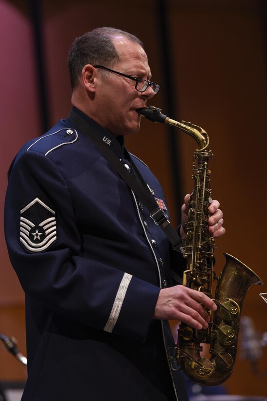 Master Sgt. Andy Axelrad, Air Force Band saxophone player, performs a solo piece in the Jazz Heritage Series at the Rachel M. Schlesinger Concert Hall in Alexandria, Va., Nov. 11, 2016. This is one of Axelrad’s last performances before he retires form 24 years of service. The Air Force Band established the Jazz Heritage Series in 1990 which features the Airmen of Note in concert with legendary jazz artists. (U.S. Air Force photo by Airman 1st Class Valentina Lopez)