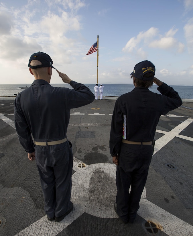 U.S Navy Sailors aboard the amphibious transportation dock ship USS Green Bay (LPD 20) salute the flag as it is raised for colors during Blue Chromite 2017 in Okinawa, Japan, October 29, 2016. Blue Chromite is a U.S. –only exercise which strengthens the Navy-Marine Corps expeditionary, amphibious rapid-response capabilities based in Okinawa and the greater Indo-Asia-Pacific region. (U.S. Marine Corps photo by Lance Cpl. Jesus McCloud)