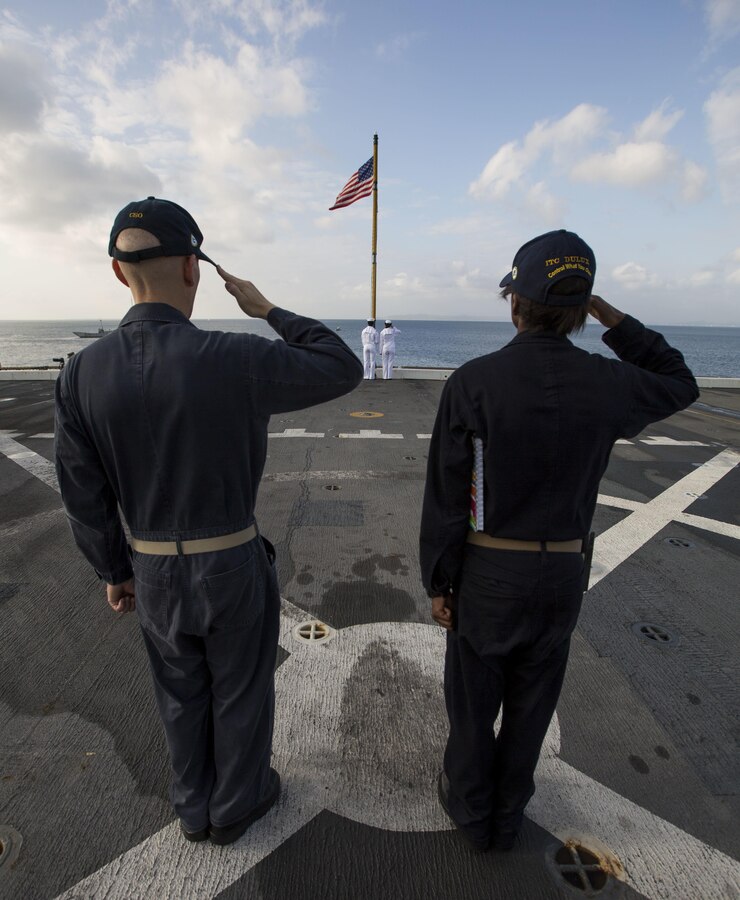 U.S Navy Sailors aboard the amphibious transportation dock ship USS Green Bay (LPD 20) salute the flag as it is raised for colors during Blue Chromite 2017 in Okinawa, Japan, October 29, 2016. Blue Chromite is a U.S. –only exercise which strengthens the Navy-Marine Corps expeditionary, amphibious rapid-response capabilities based in Okinawa and the greater Indo-Asia-Pacific region. (U.S. Marine Corps photo by Lance Cpl. Jesus McCloud)