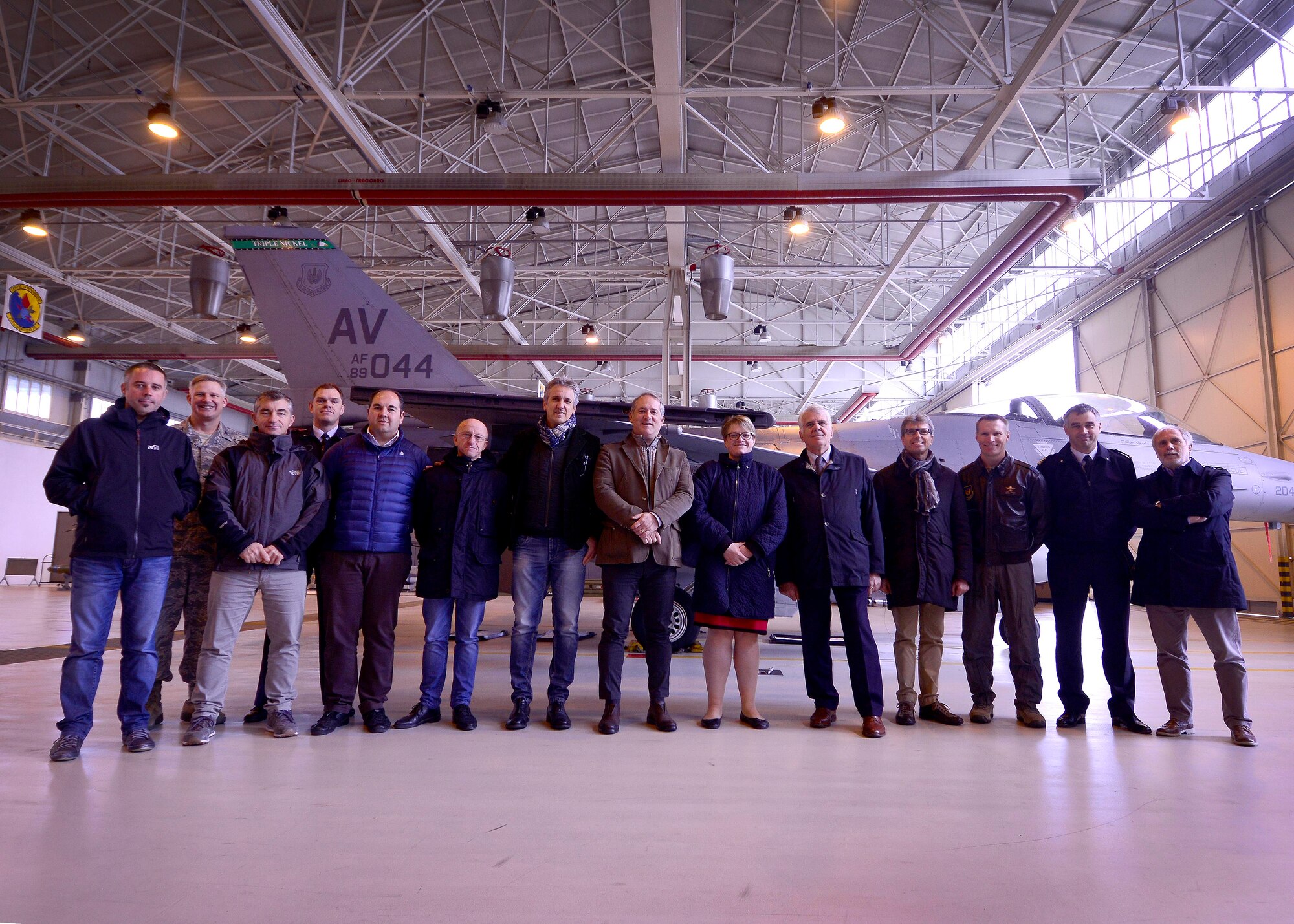 31st Fighter Wing leaders and Italian mayors from the local community pose for a photo during Mayor’s Day at Aviano Air Base, Italy on Nov. 11, 2016. The tour was hosted to introduce local community leaders to the 31st Fighter Wing mission. (U.S. Air Force photo by Senior Airman Areca T. Bell)