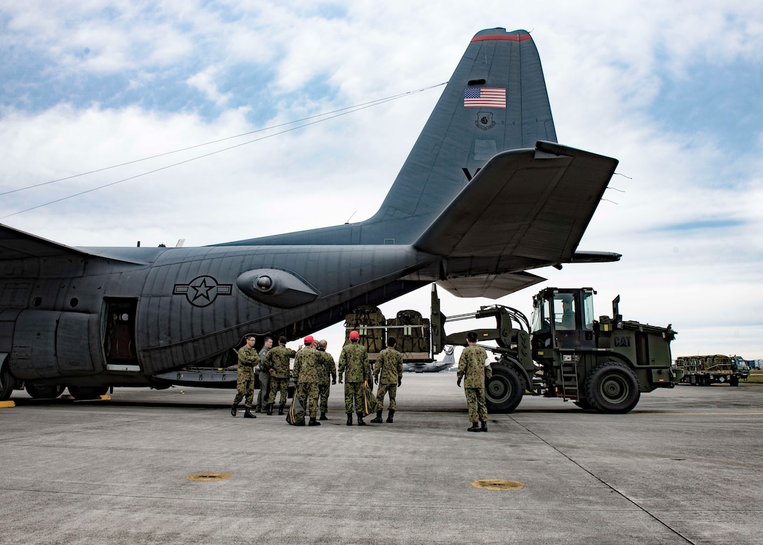 Japan Ground Self-Defense Force and 36th Airlift Squadron members load container delivery system bundles onto a C-130 Hercules during Keen Sword 2017, Nov. 10, 2016, at Yokota Air Base, Japan. Keen Sword is the largest joint, bilateral field training exercise between the U.S. military and the Japan Self-Defense Force. (U.S. Air Force photo by Airman 1st Class Donald Hudson/Released)