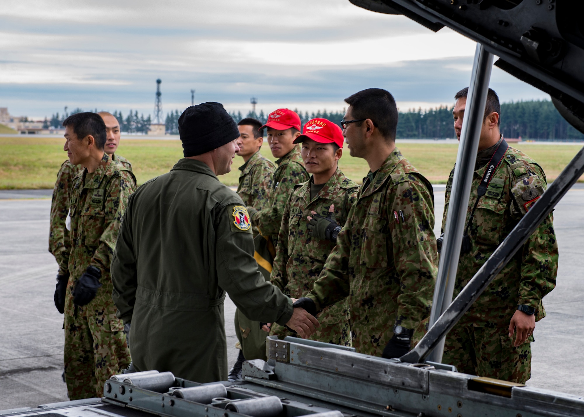 Master Sgt. Todd M. Bergin, 374th Operations Group superintendent, shakes hands with Japan Ground Self-Defense Force members during Keen Sword 2017, Nov. 10, 2016, at Yokota Air Base, Japan. Keen Sword is the largest joint, bilateral field training exercise between the U.S. military and the Japan Self-Defense Force. (U.S. Air Force photo by Airman 1st Class Donald Hudson/Released)